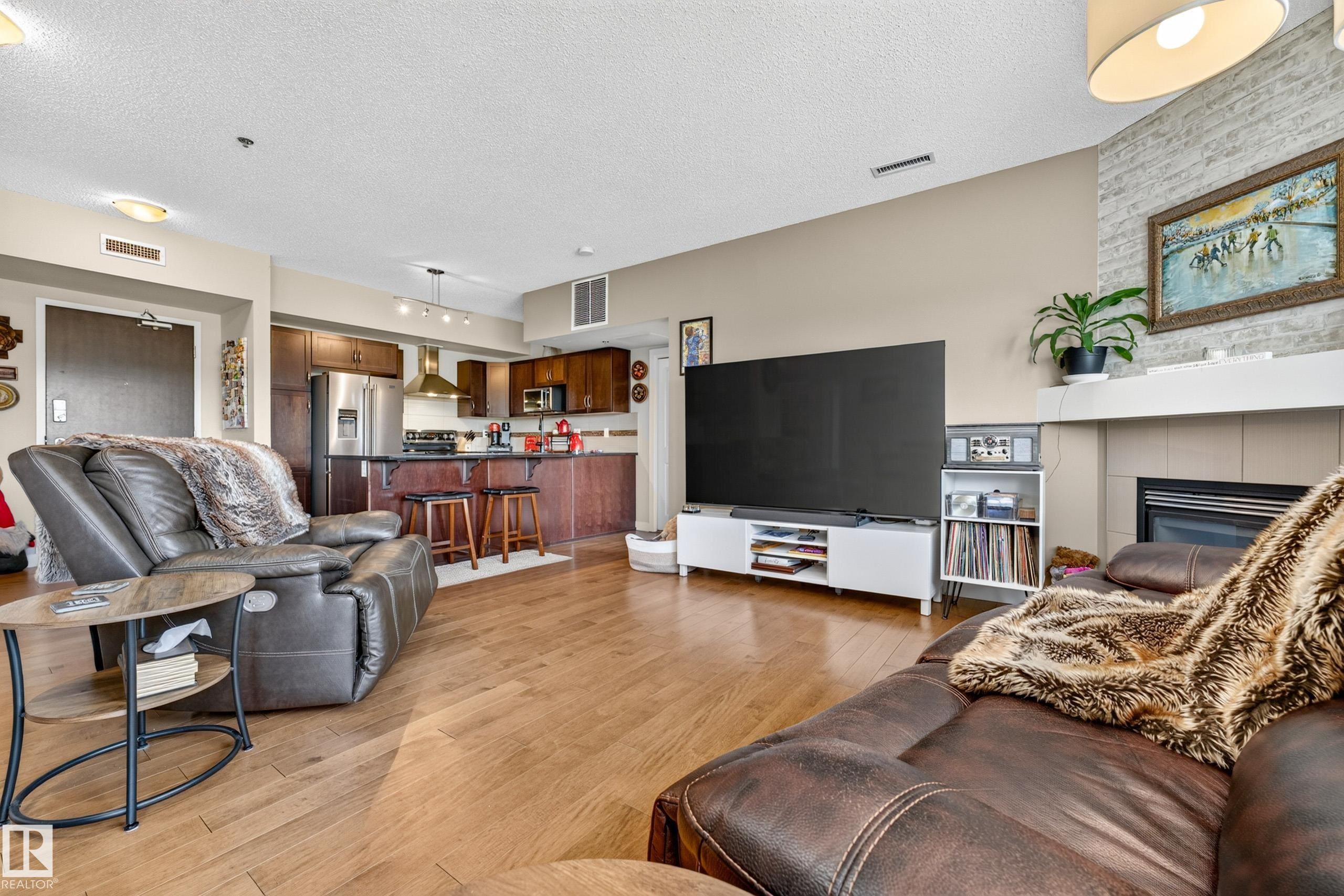 #115 35 Sturgeon Rd, St. Albert, AB - Indoor Photo Showing Living Room With Fireplace