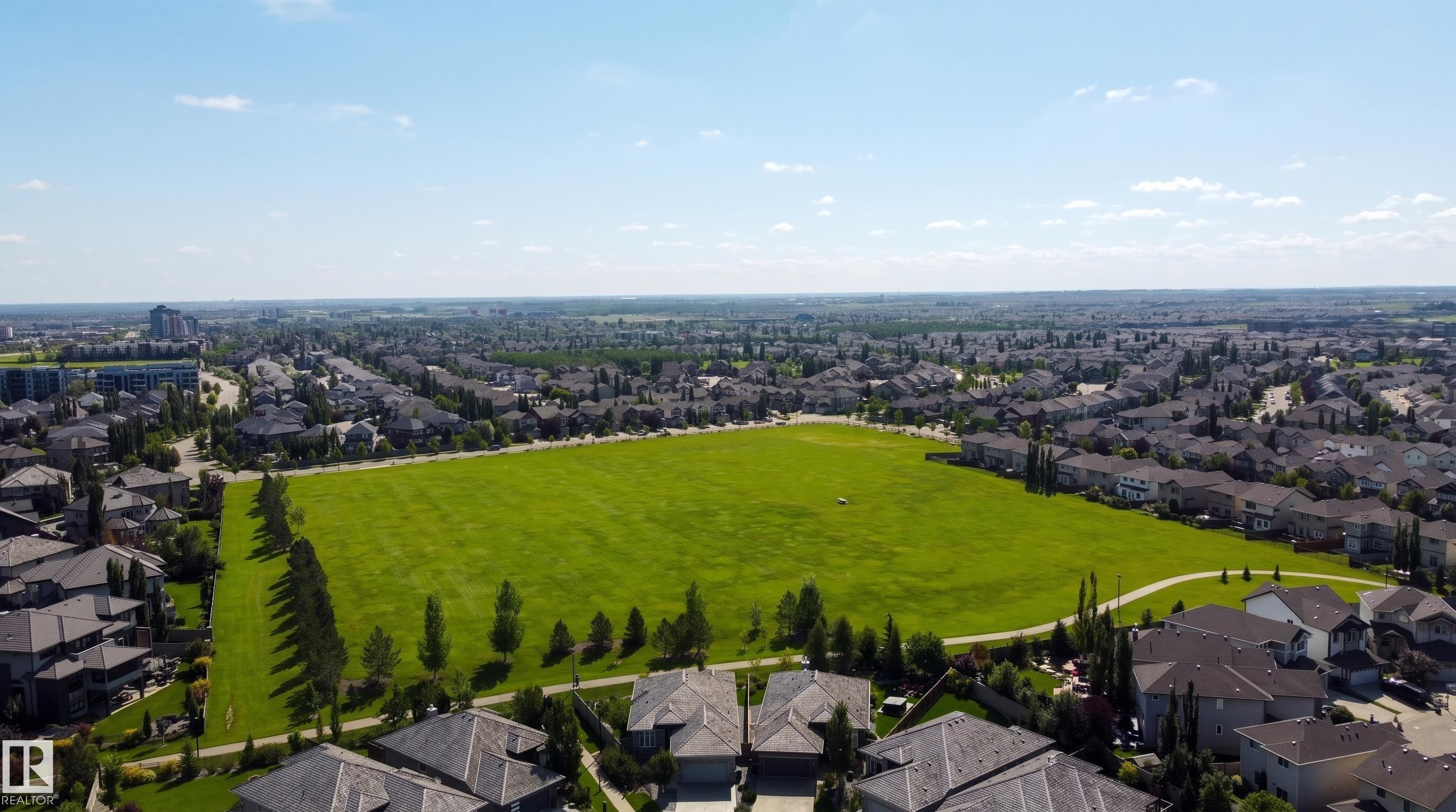 Expansive green space bordered by paved pathways and mature trees - 3644 Westcliff Way Sw, Edmonton, AB - Outdoor With View