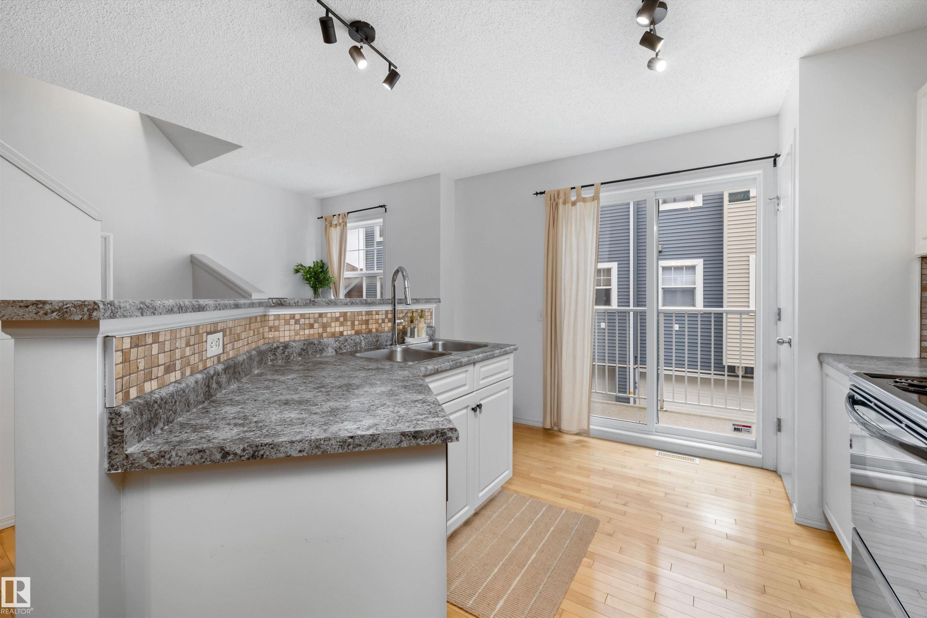 #83 8304 11 Av Sw, Edmonton, AB - Indoor Photo Showing Kitchen With Double Sink