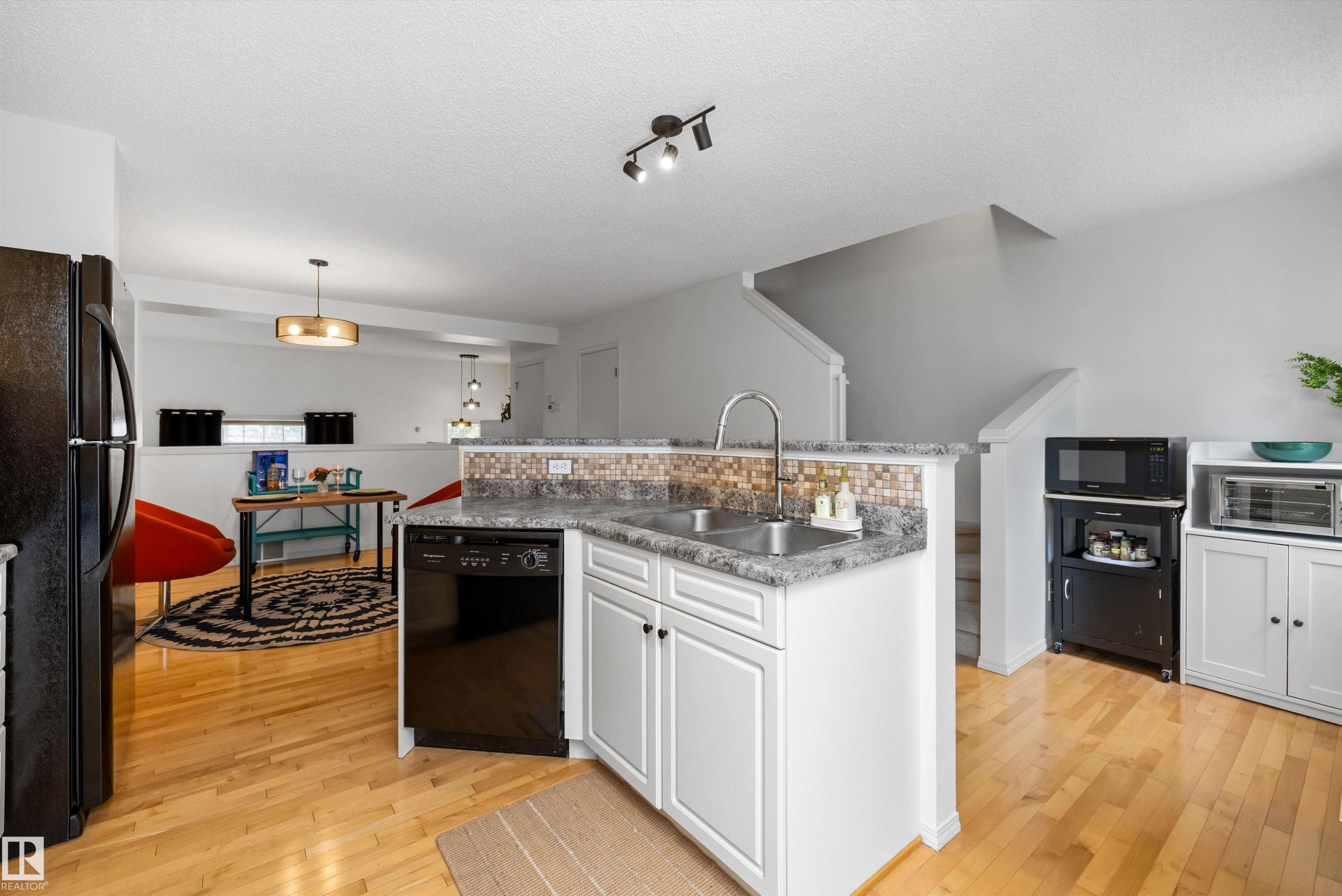 #83 8304 11 Av Sw, Edmonton, AB - Indoor Photo Showing Kitchen With Double Sink