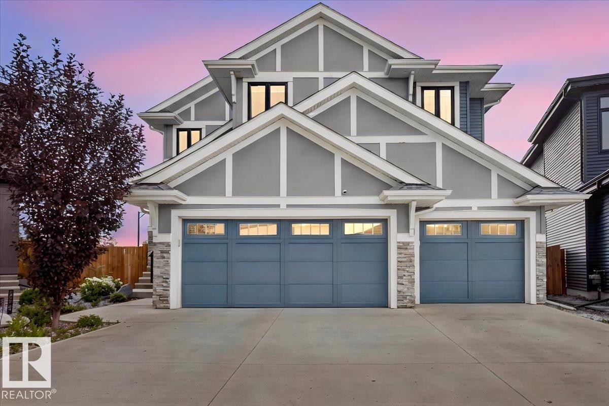 Contemporary exterior with a multi-gabled roofline and light gray siding - 6813 Knox Loop Sw, Edmonton, AB - Outdoor With Facade