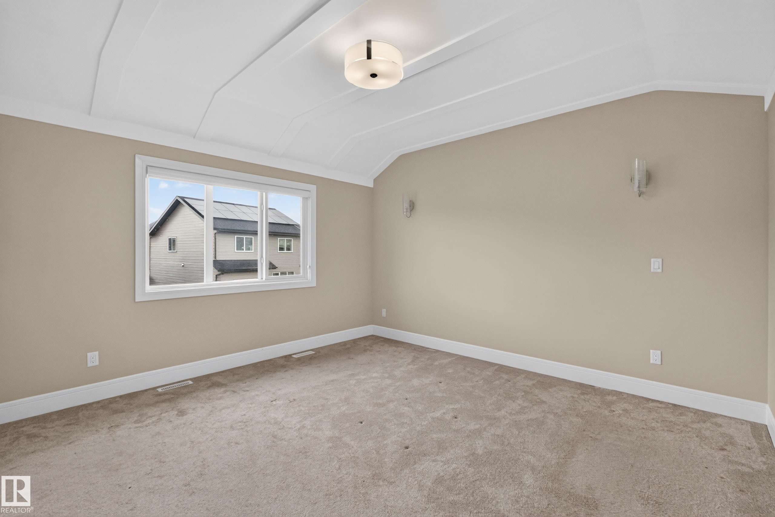 Neutral-toned wall paint, white trim, and carpeted flooring - 7014 Chivers Loop Sw, Edmonton, AB