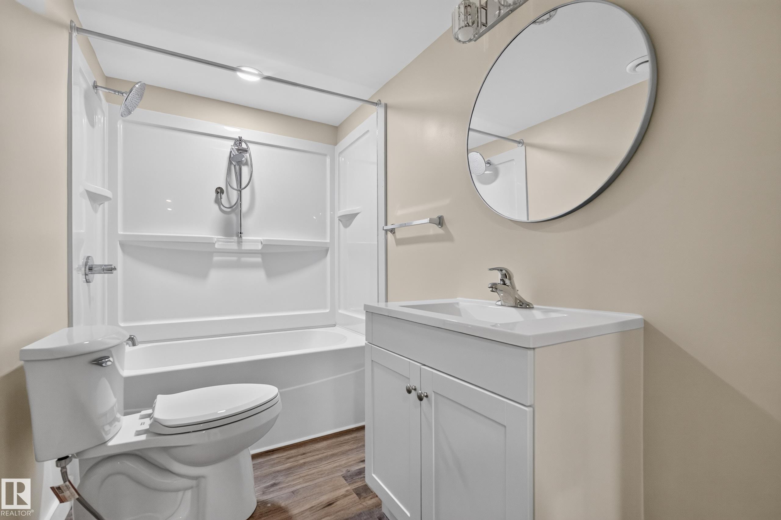 White vanity with an integrated sink and chrome faucet - 7014 Chivers Loop Sw, Edmonton, AB