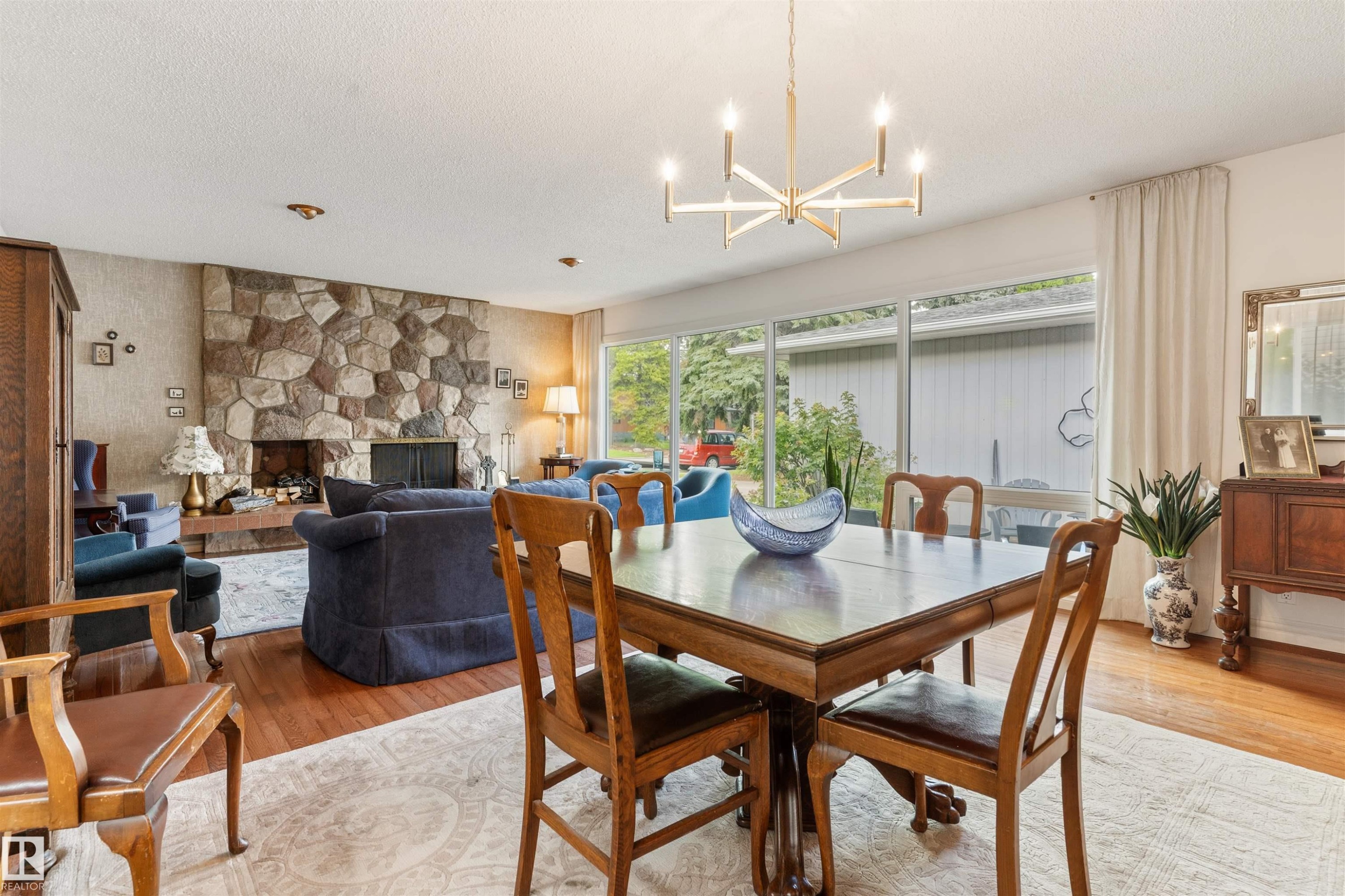 7 Quesnell Crescent Nw, Edmonton, AB - Indoor Photo Showing Dining Room With Fireplace