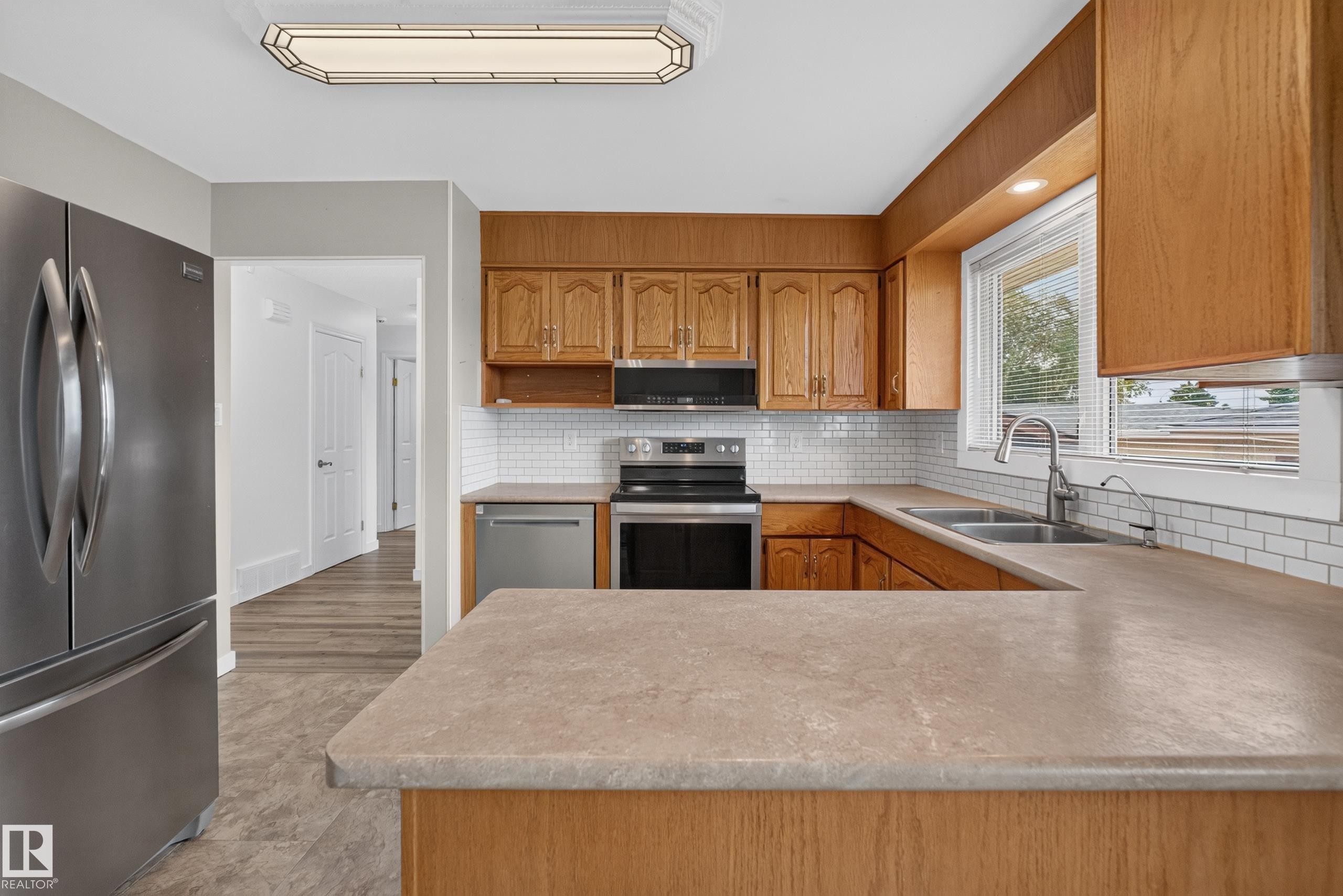 8015 145 Avenue Nw, Edmonton, AB - Indoor Photo Showing Kitchen With Stainless Steel Kitchen With Double Sink