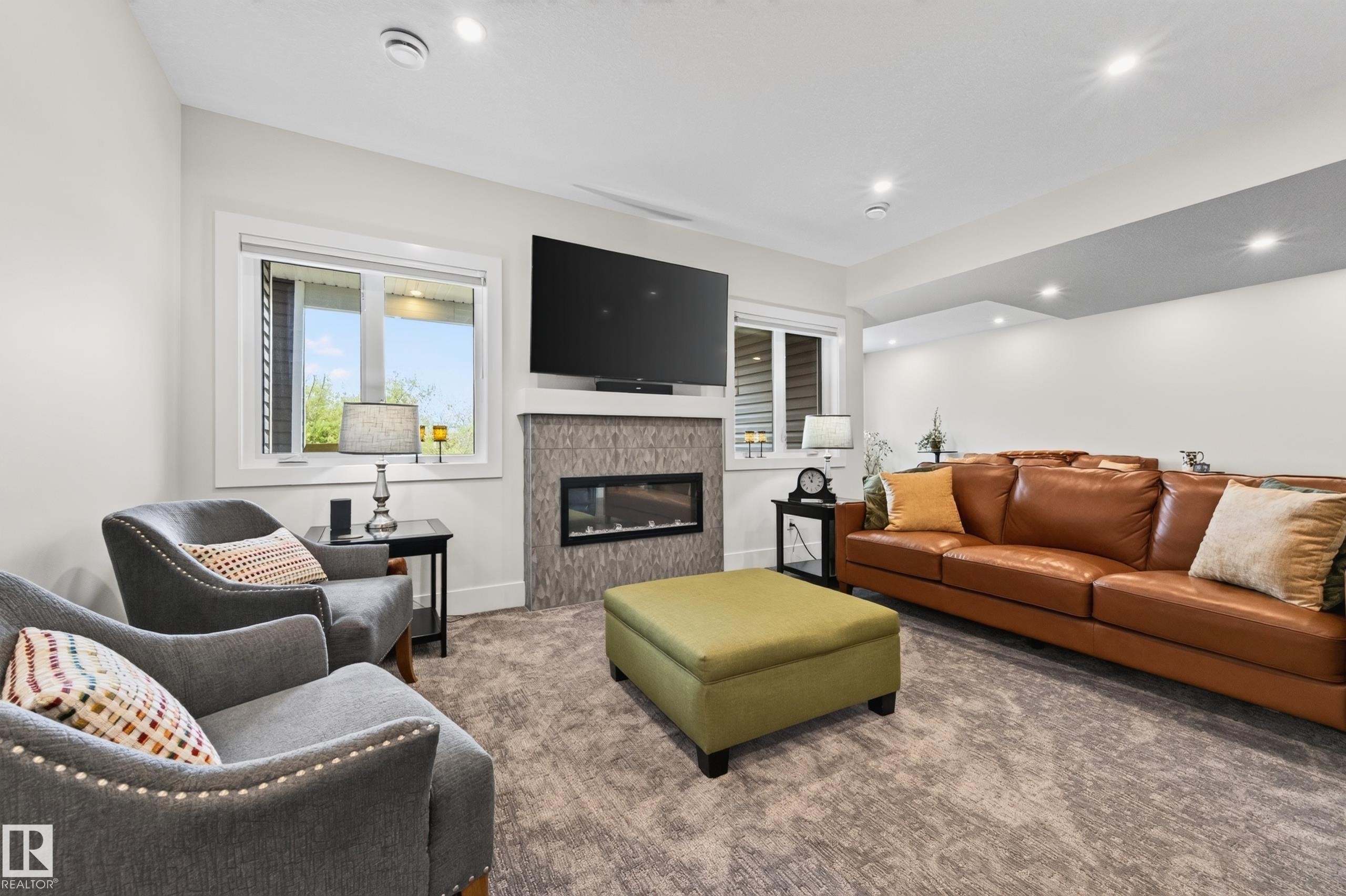 Walkout basement - 91 Harvest Crescent, Ardrossan, AB - Indoor Photo Showing Living Room With Fireplace