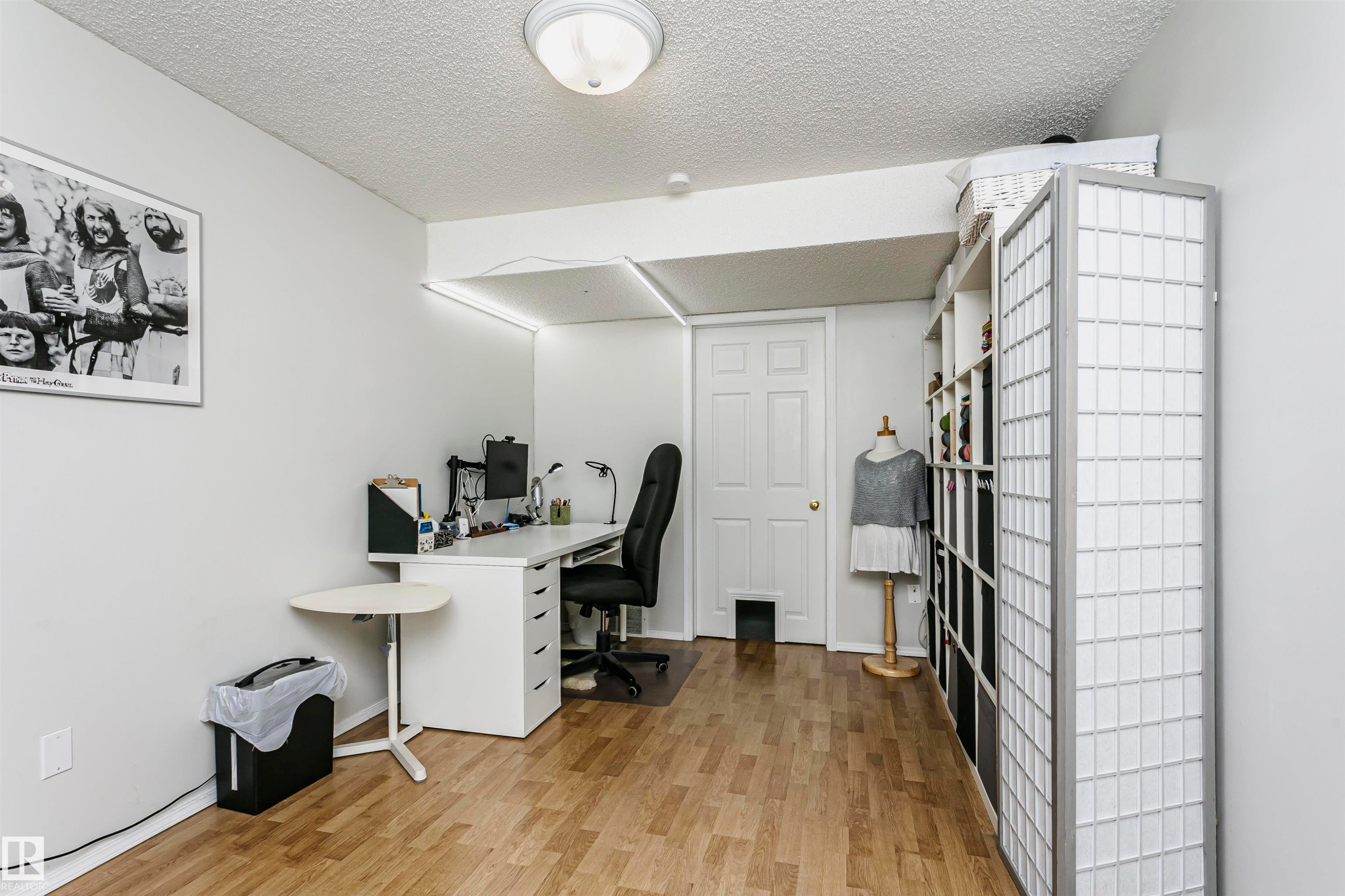 Wood-finish flooring throughout - #42 9630 176 St Nw, Edmonton, AB - Indoor Photo Showing Office