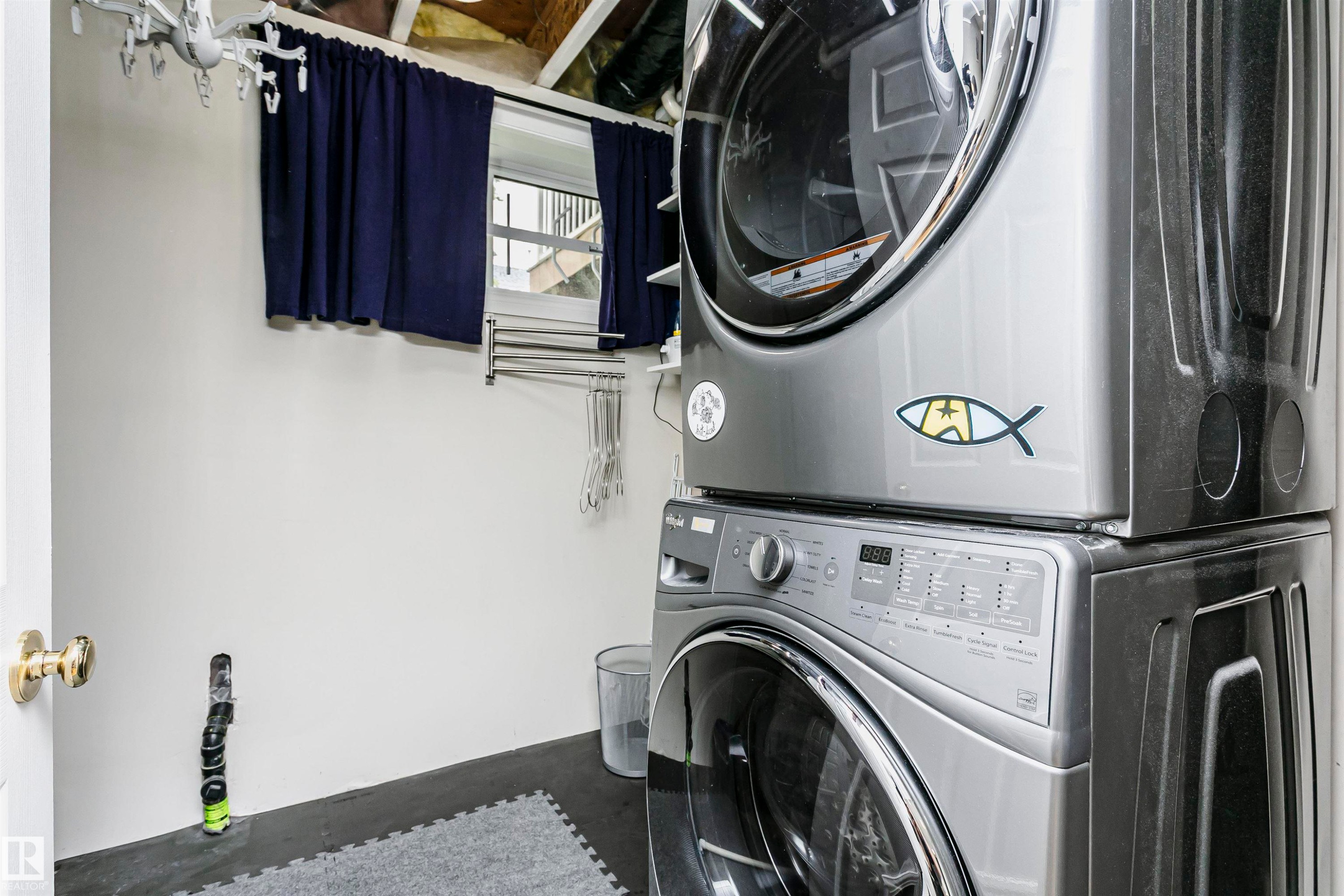 Laundry area with white walls and dark flooring - #42 9630 176 St Nw, Edmonton, AB - Indoor Photo Showing Laundry Room