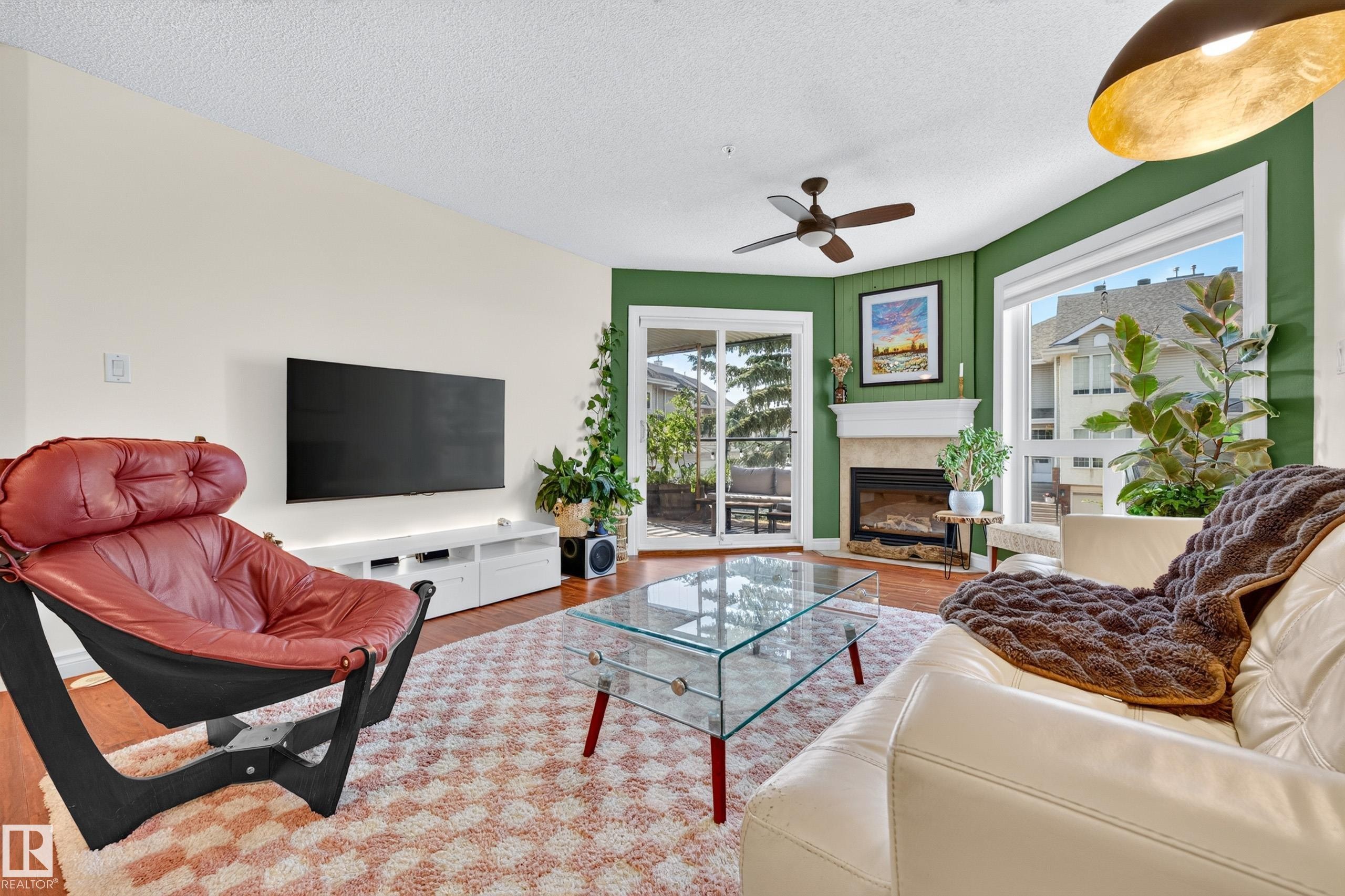 #206 7839 96 St Nw, Edmonton, AB - Indoor Photo Showing Living Room With Fireplace