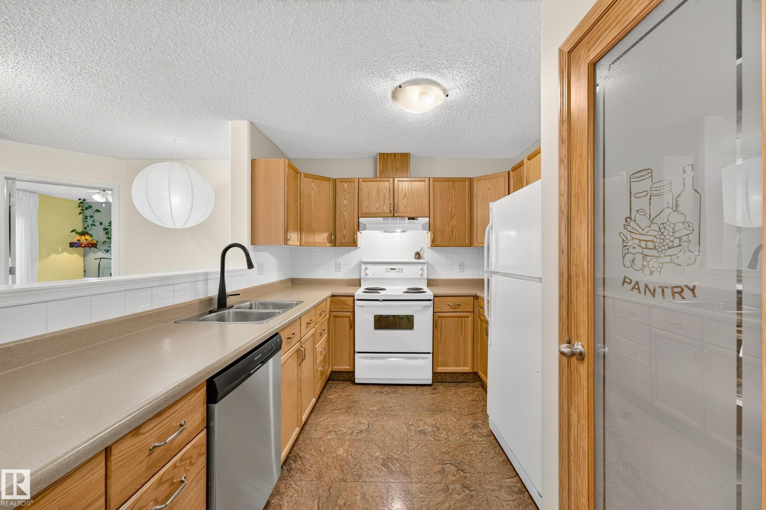 #206 7839 96 St Nw, Edmonton, AB - Indoor Photo Showing Kitchen With Double Sink