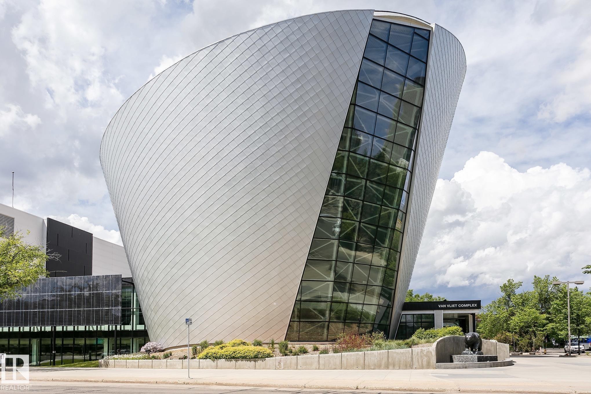 Curved metal panel facade with extensive glass curtain wall - 11139 62 Avenue Nw, Edmonton, AB - Outdoor