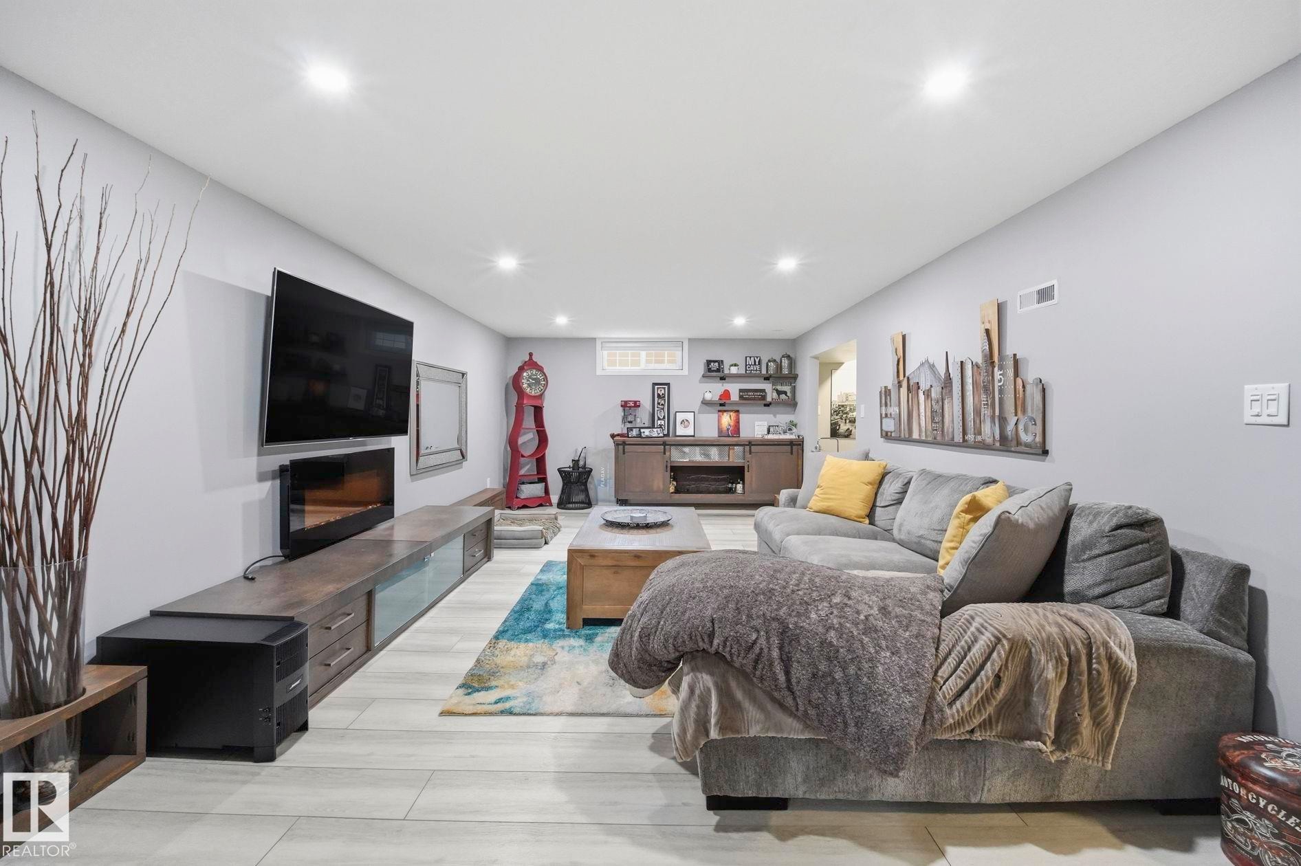 10528 45 Street Nw, Edmonton, AB - Indoor Photo Showing Living Room With Fireplace