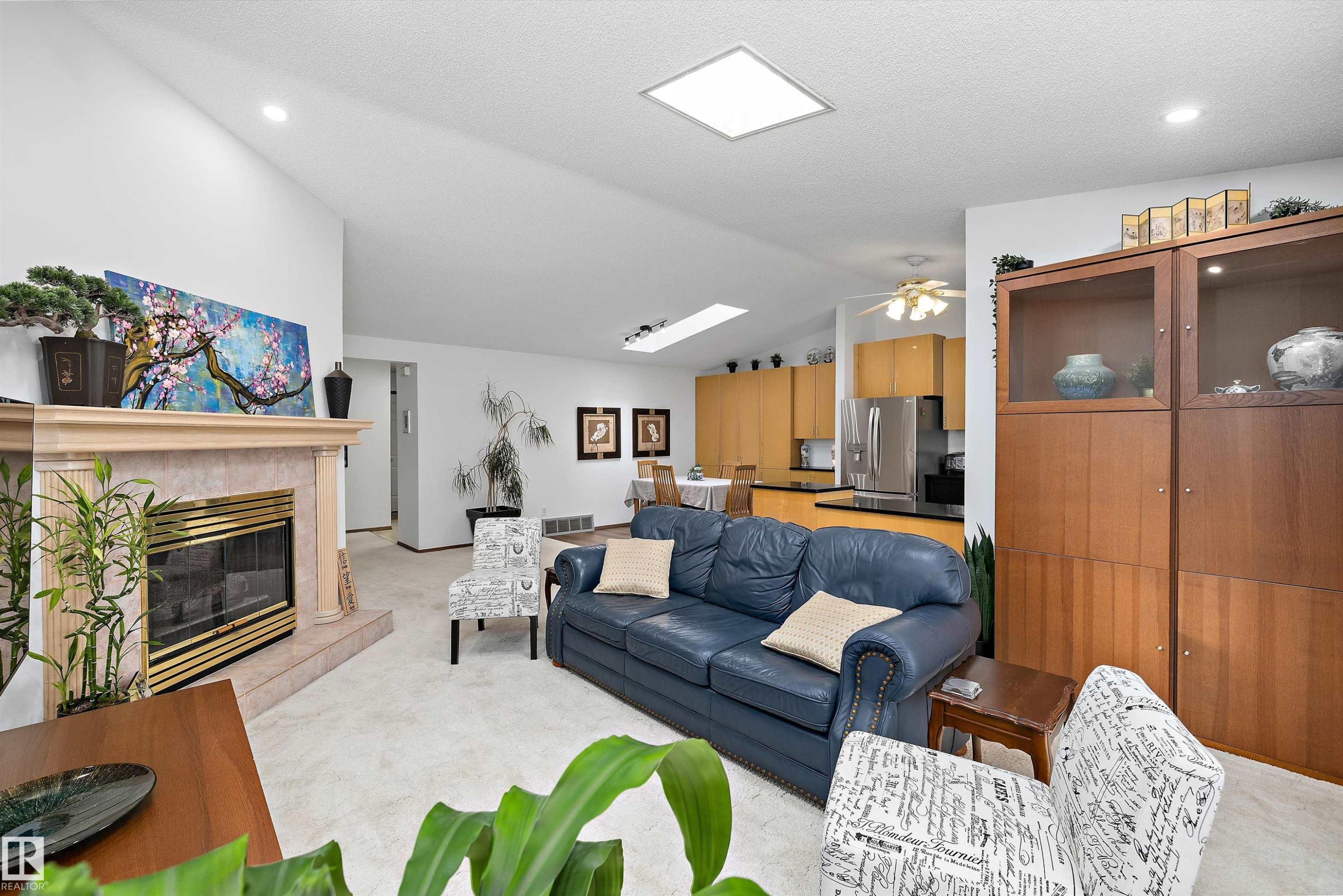 4717 25 Avenue Nw, Edmonton, AB - Indoor Photo Showing Living Room With Fireplace