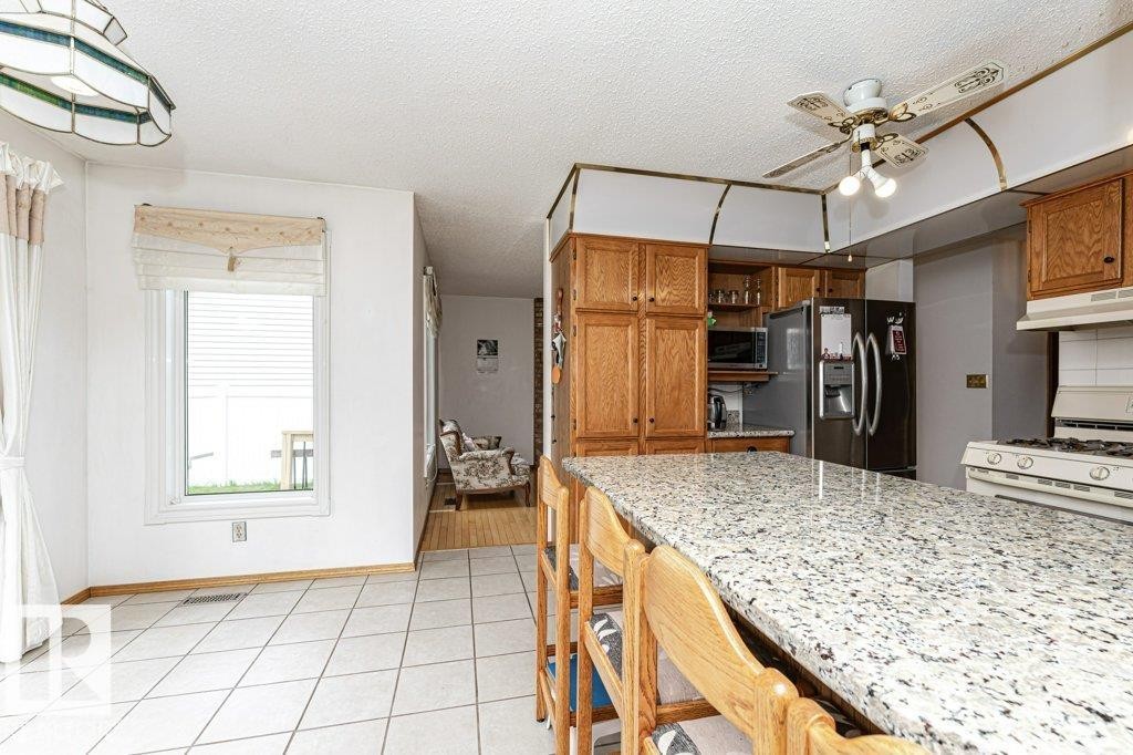 3303 42A Avenue Nw, Edmonton, AB - Indoor Photo Showing Kitchen