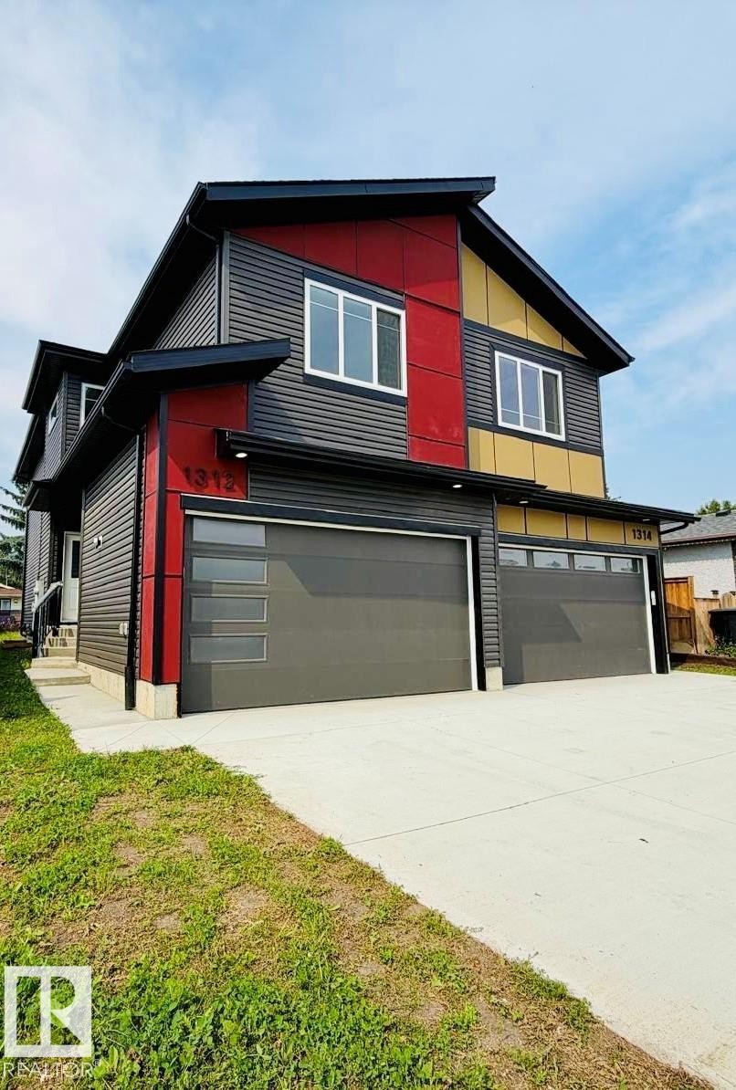 Modern architectural design featuring red and gold accent panels - 1312 35 Street Nw, Edmonton, AB