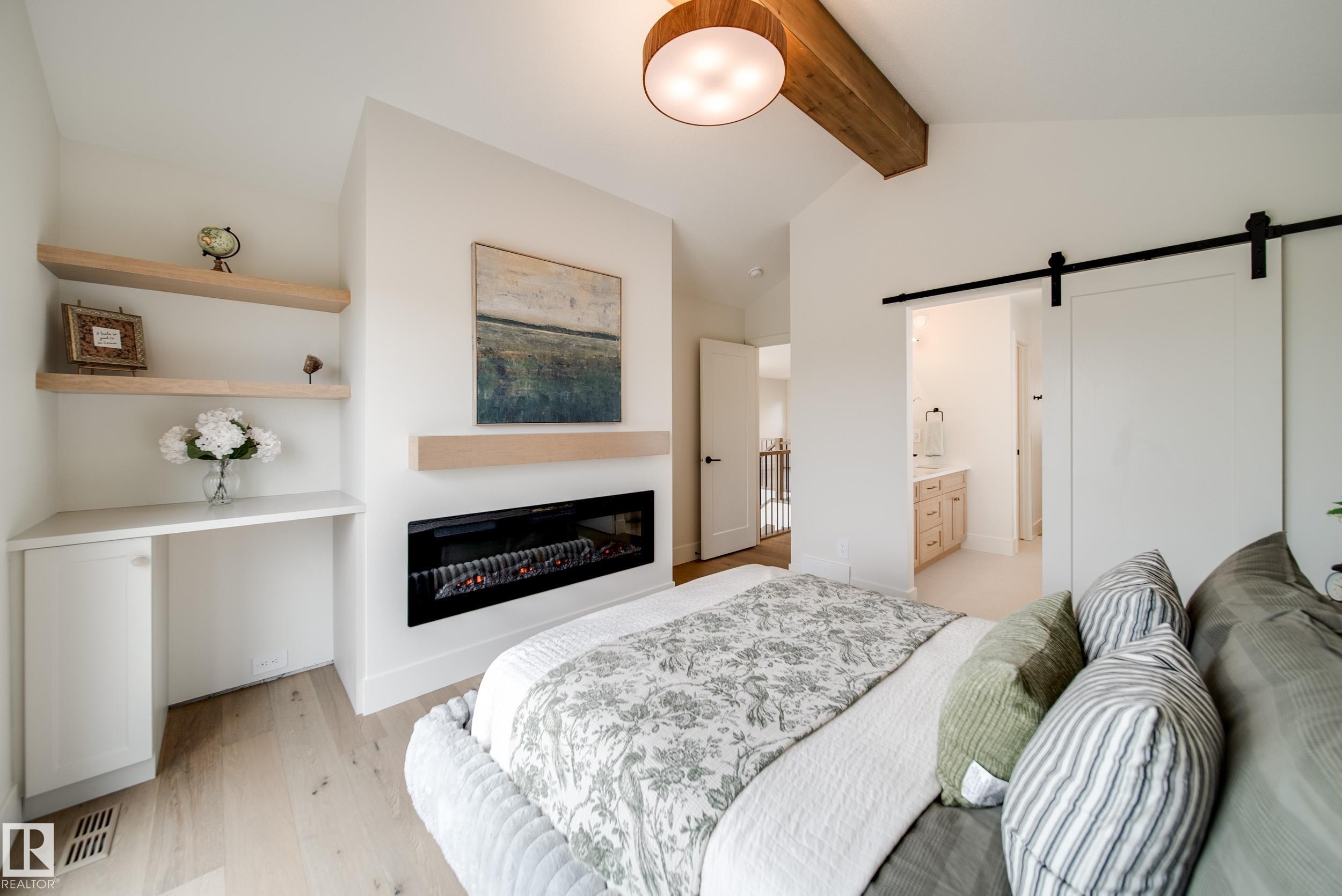 95 Jubilation Drive, St. Albert, AB - Indoor Photo Showing Bedroom With Fireplace