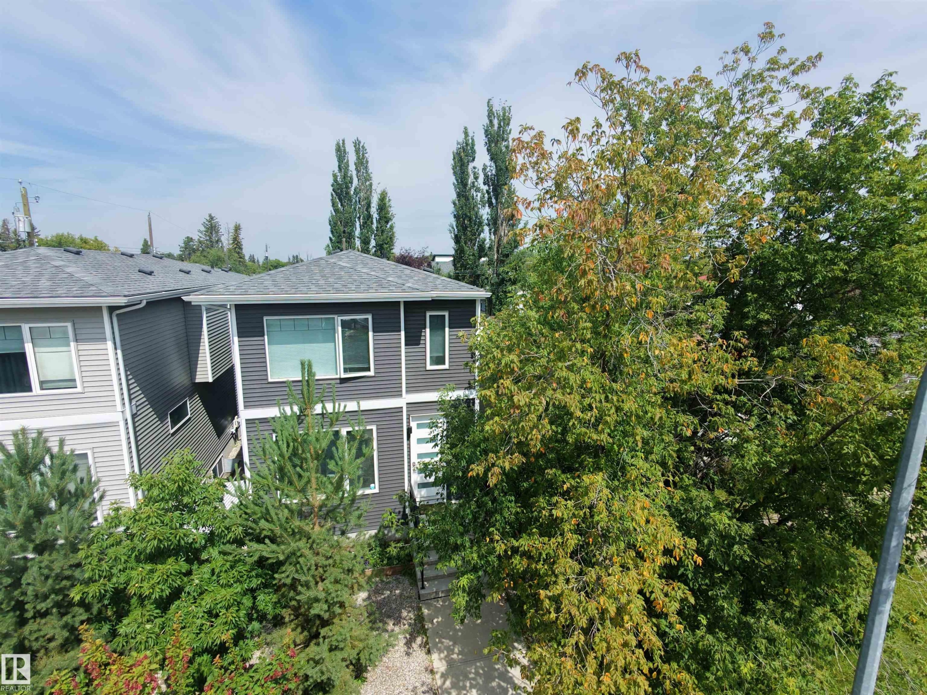 Multi-story property featuring dark gray siding and white trim - 15212 98 Avenue Nw, Edmonton, AB - Outdoor
