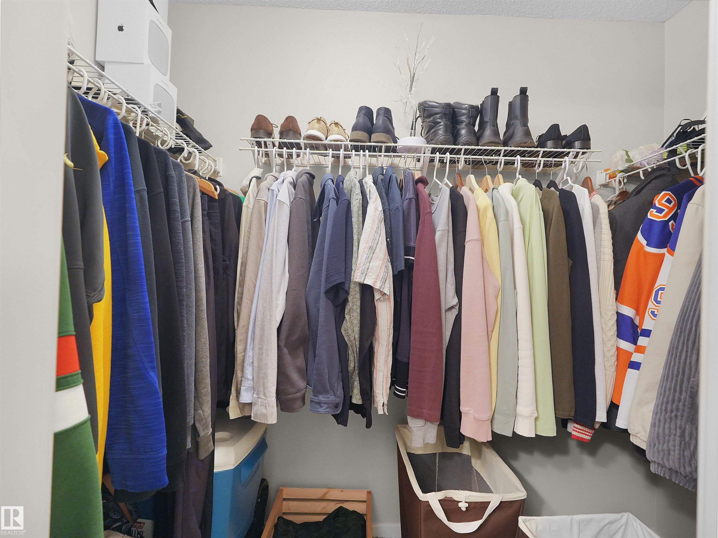 Walk-in closet featuring wire shelving and clothing rods - #89 603 Watt Bv Sw, Edmonton, AB - Indoor With Storage
