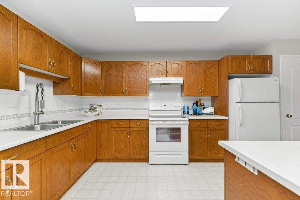 #208 10421 42 Av Nw, Edmonton, AB - Indoor Photo Showing Kitchen With Double Sink