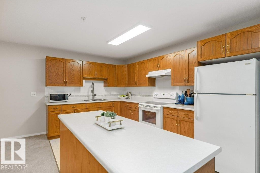 #208 10421 42 Av Nw, Edmonton, AB - Indoor Photo Showing Kitchen With Double Sink