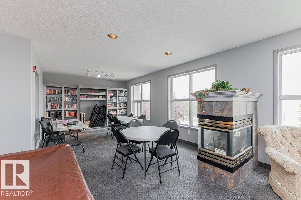 #208 10421 42 Av Nw, Edmonton, AB - Indoor With Fireplace