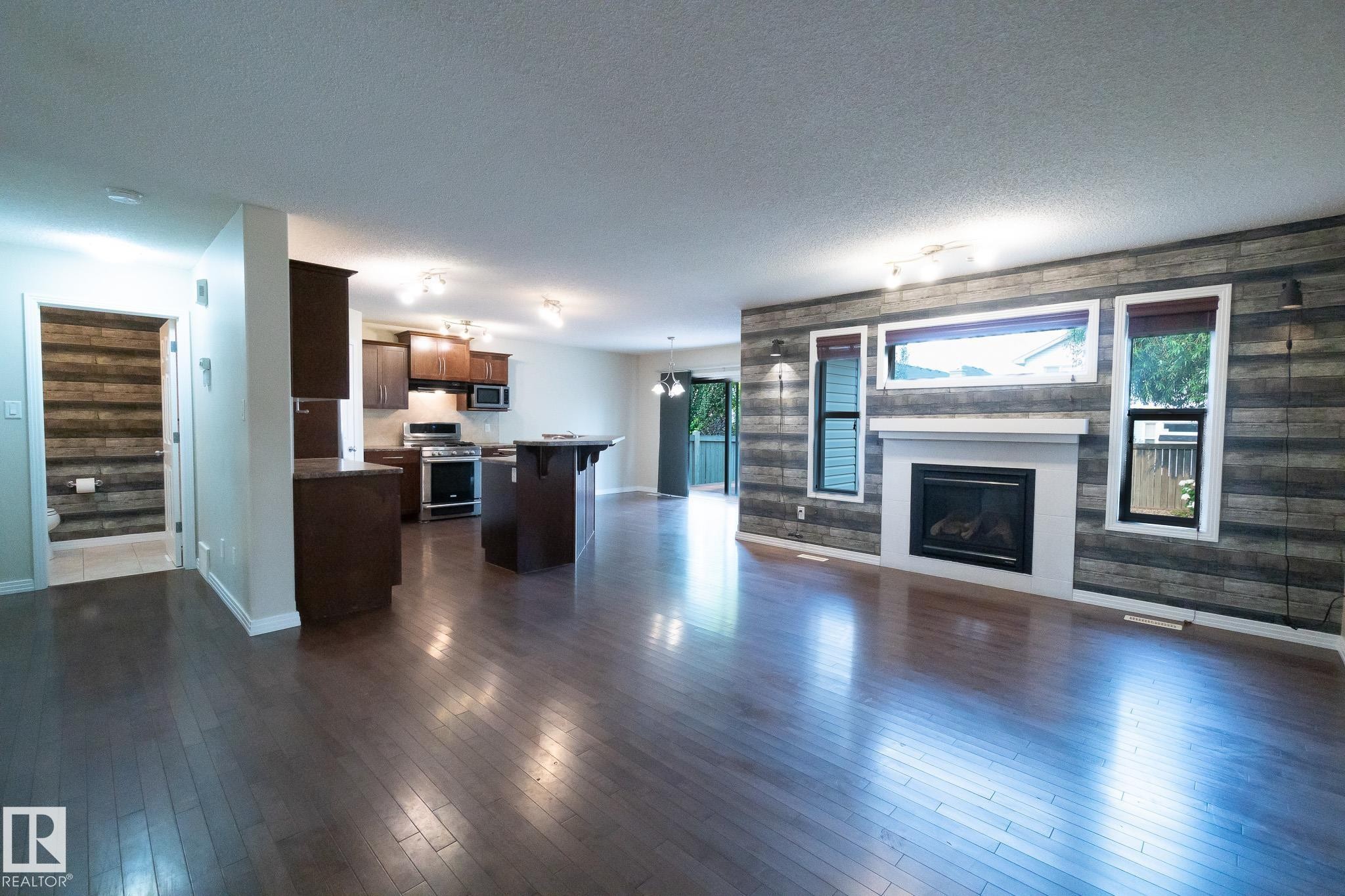 632 60 Street Sw, Edmonton, AB - Indoor Photo Showing Living Room With Fireplace
