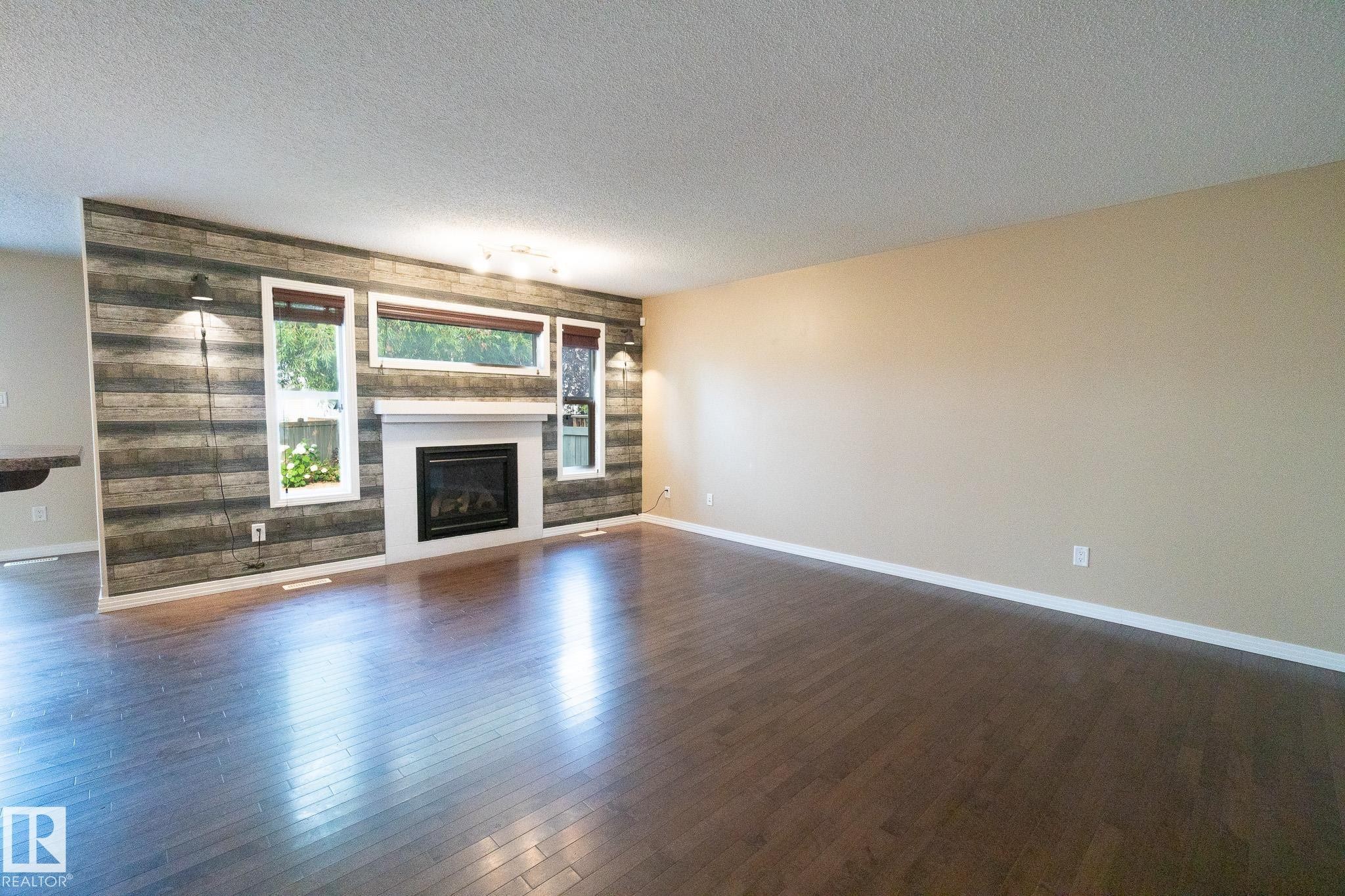 632 60 Street Sw, Edmonton, AB - Indoor Photo Showing Living Room With Fireplace