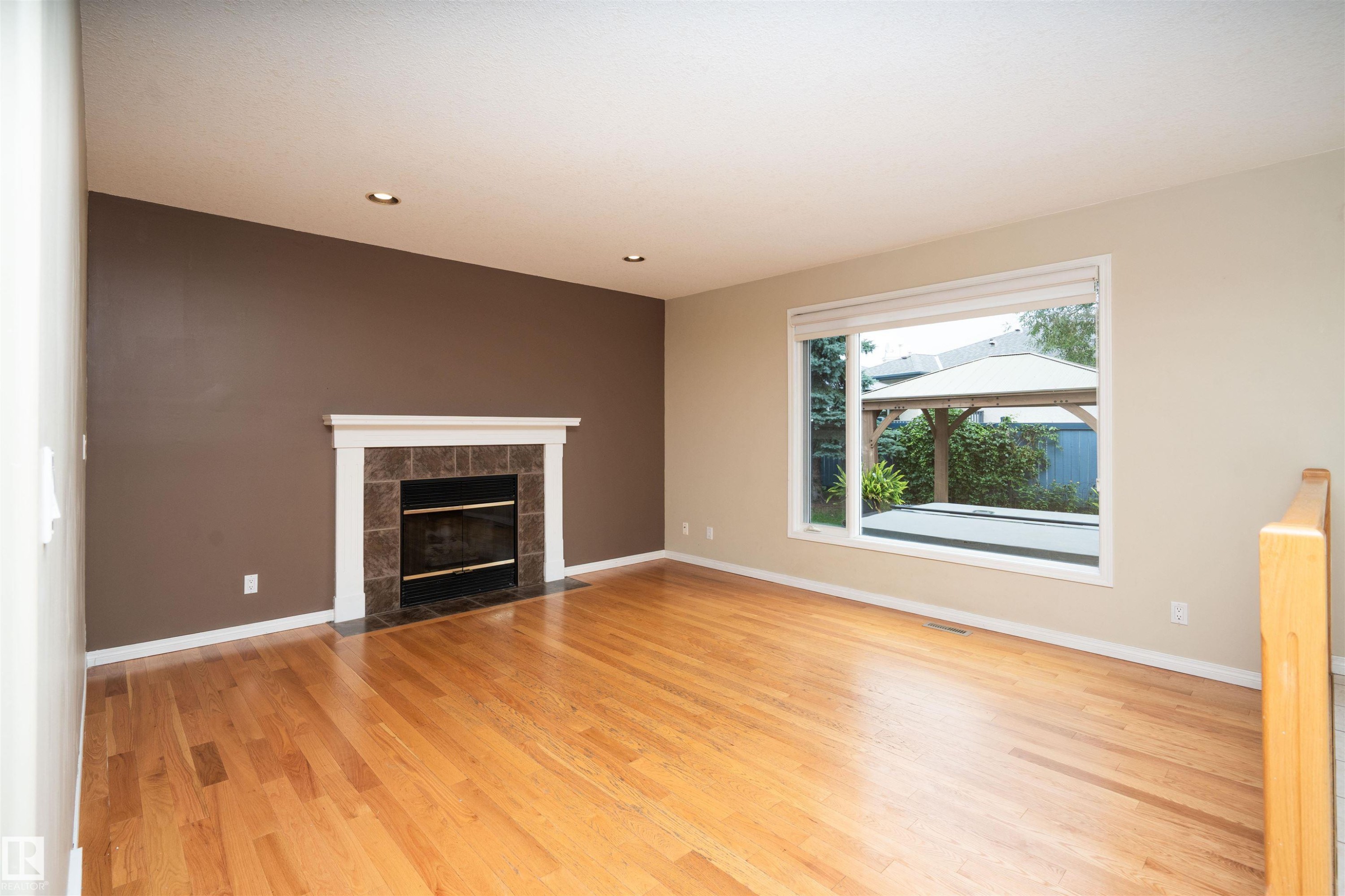 3811 44 Street Nw, Edmonton, AB - Indoor Photo Showing Living Room With Fireplace
