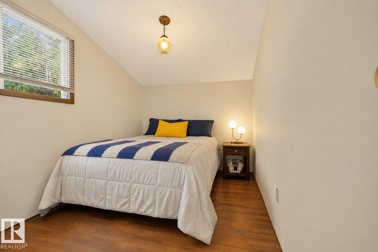 Sloped ceiling with recessed lighting - 264 Beach Avenue, Rural Barrhead County, AB - Indoor Photo Showing Bedroom