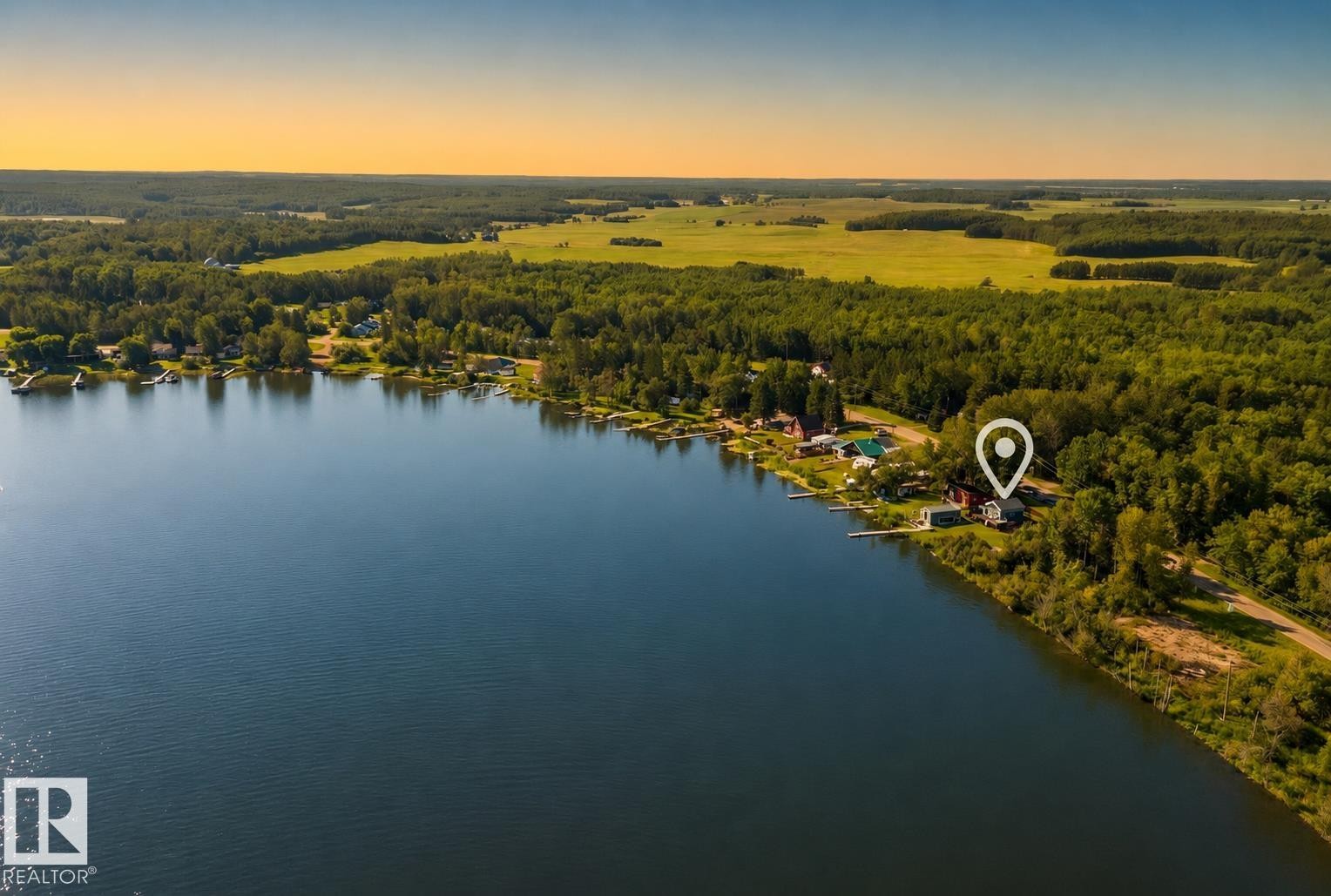 Expansive lakefront property with private dock, surrounded by mature trees and open fields - 264 Beach Avenue, Rural Barrhead County, AB - Outdoor With Body Of Water With View