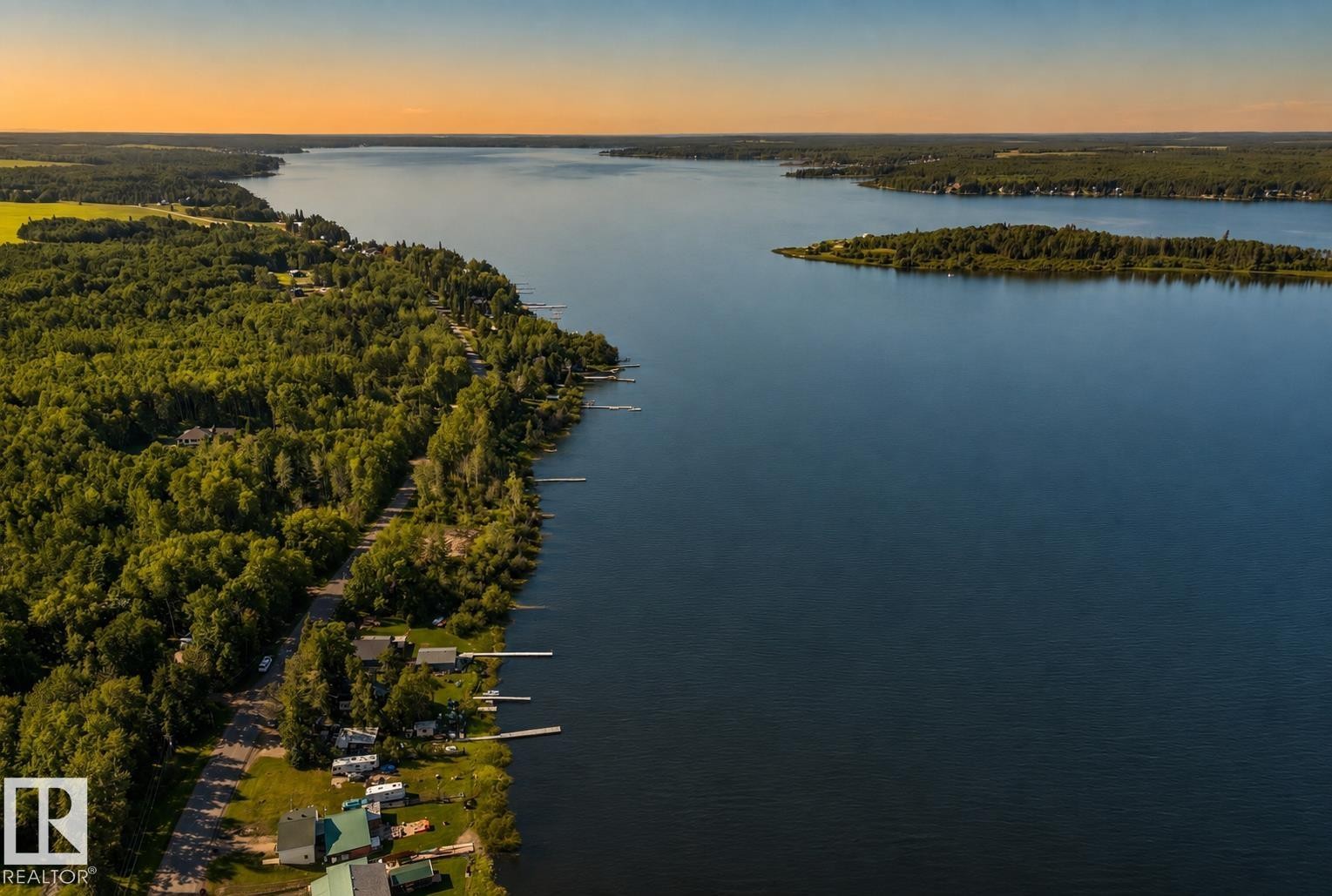 Waterfront properties featuring multiple docks and extensive wooded areas - 264 Beach Avenue, Rural Barrhead County, AB - Outdoor With Body Of Water With View