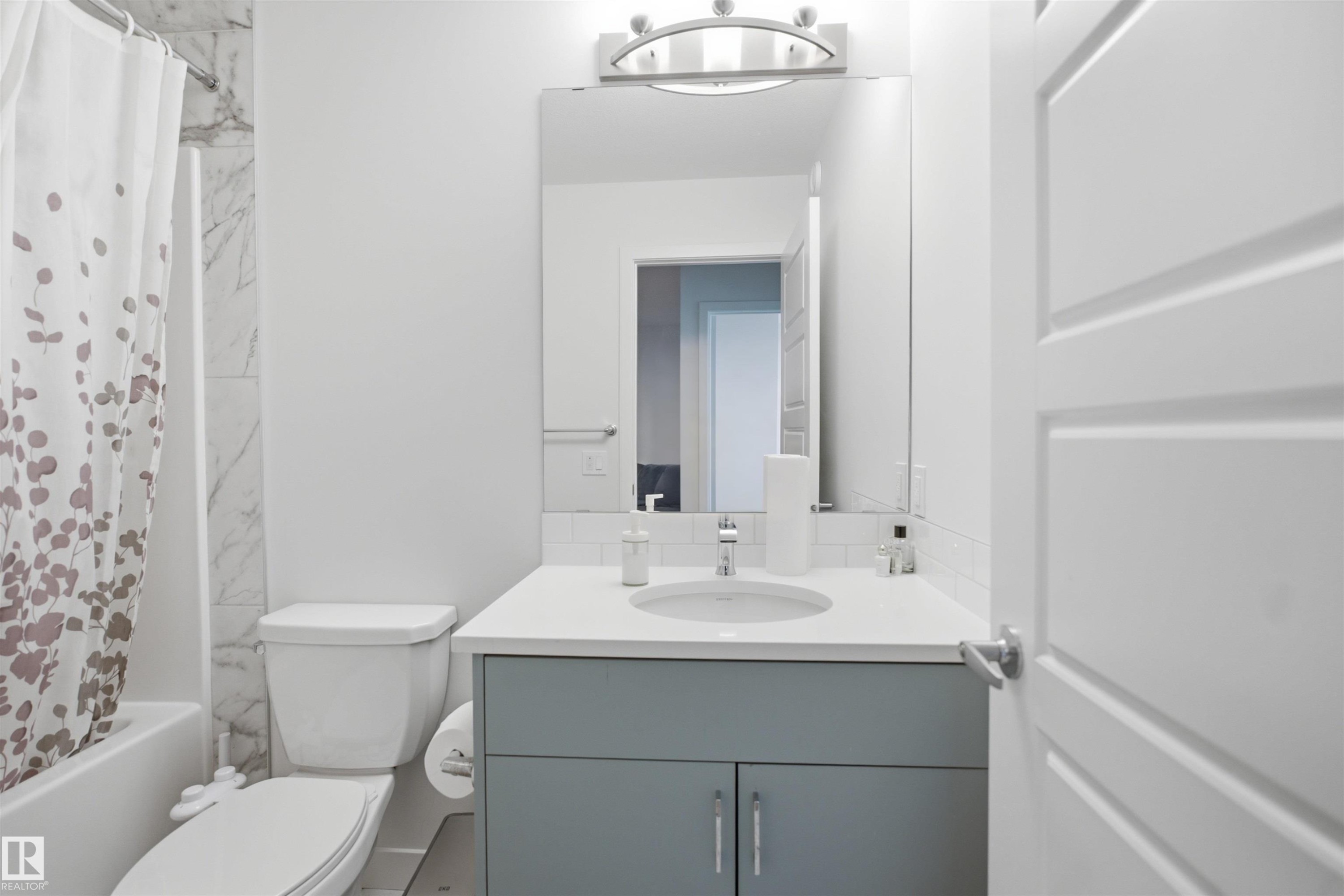 White paneled door with brushed nickel hardware - 3877 Chrustawka Place Sw, Edmonton, AB - Indoor Photo Showing Bathroom