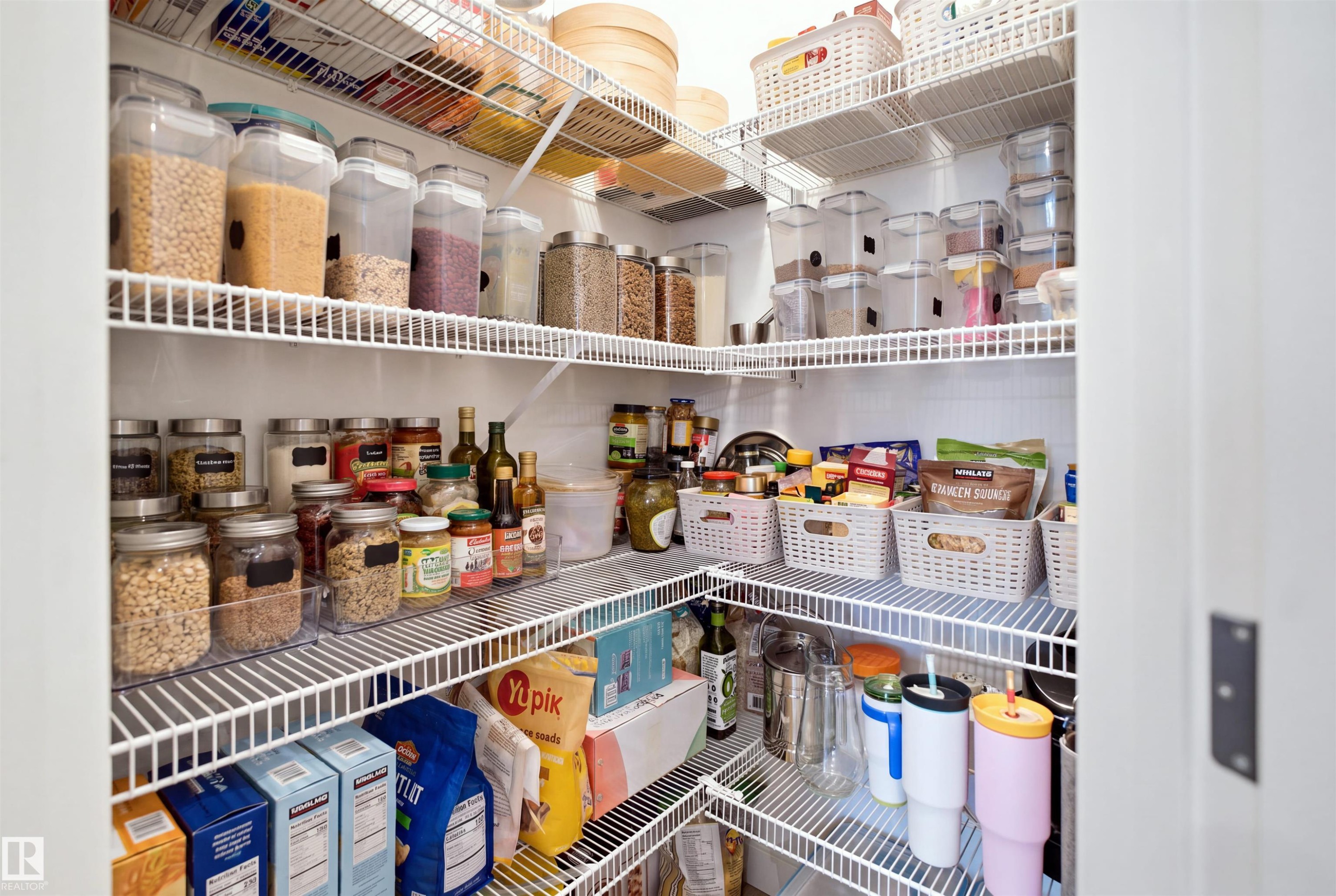 Corner pantry with multiple wire shelving units - 3877 Chrustawka Place Sw, Edmonton, AB - Indoor