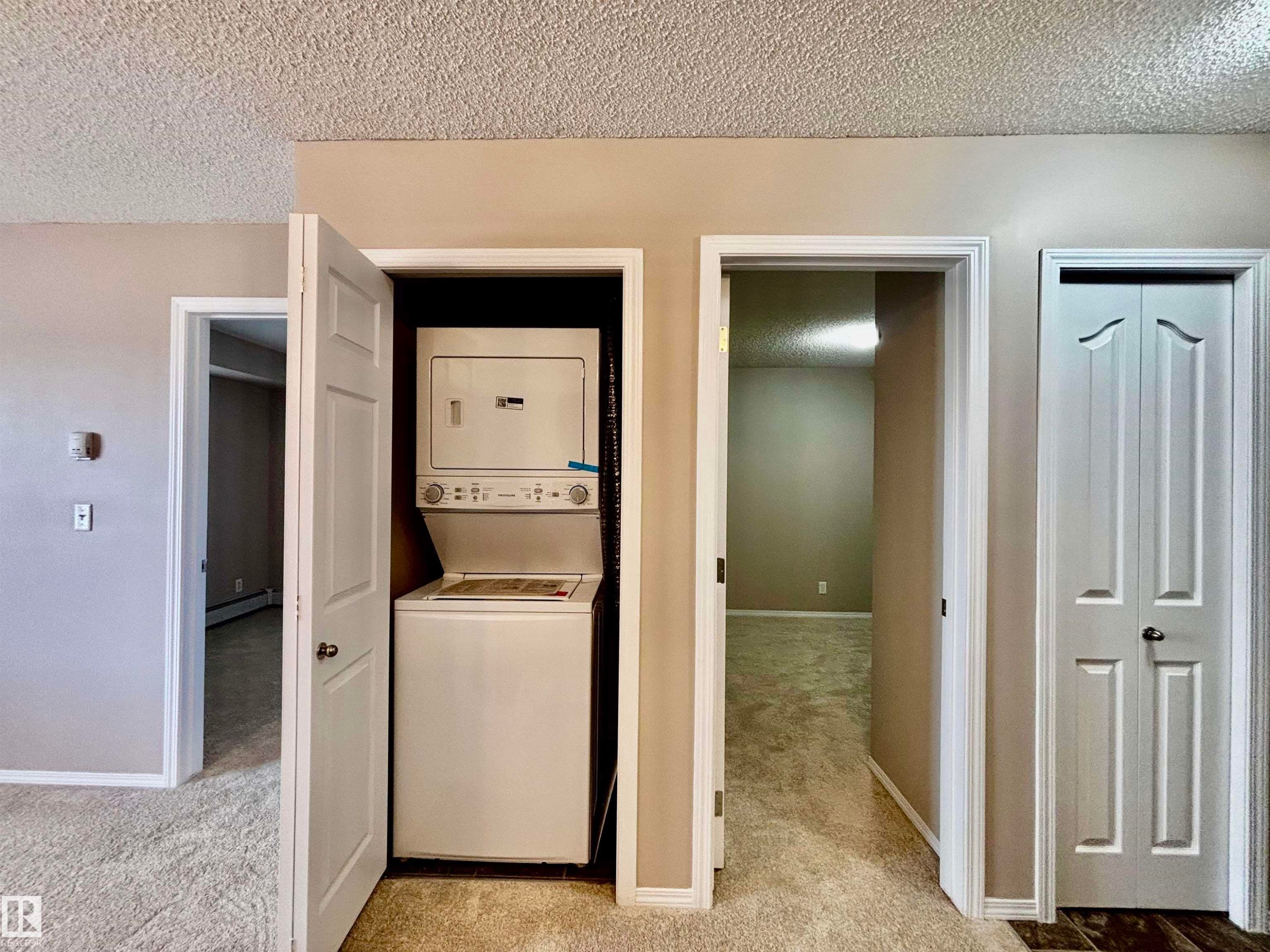 Brand new washer and dryer - #409 12035 22 Av Sw, Edmonton, AB - Indoor Photo Showing Laundry Room