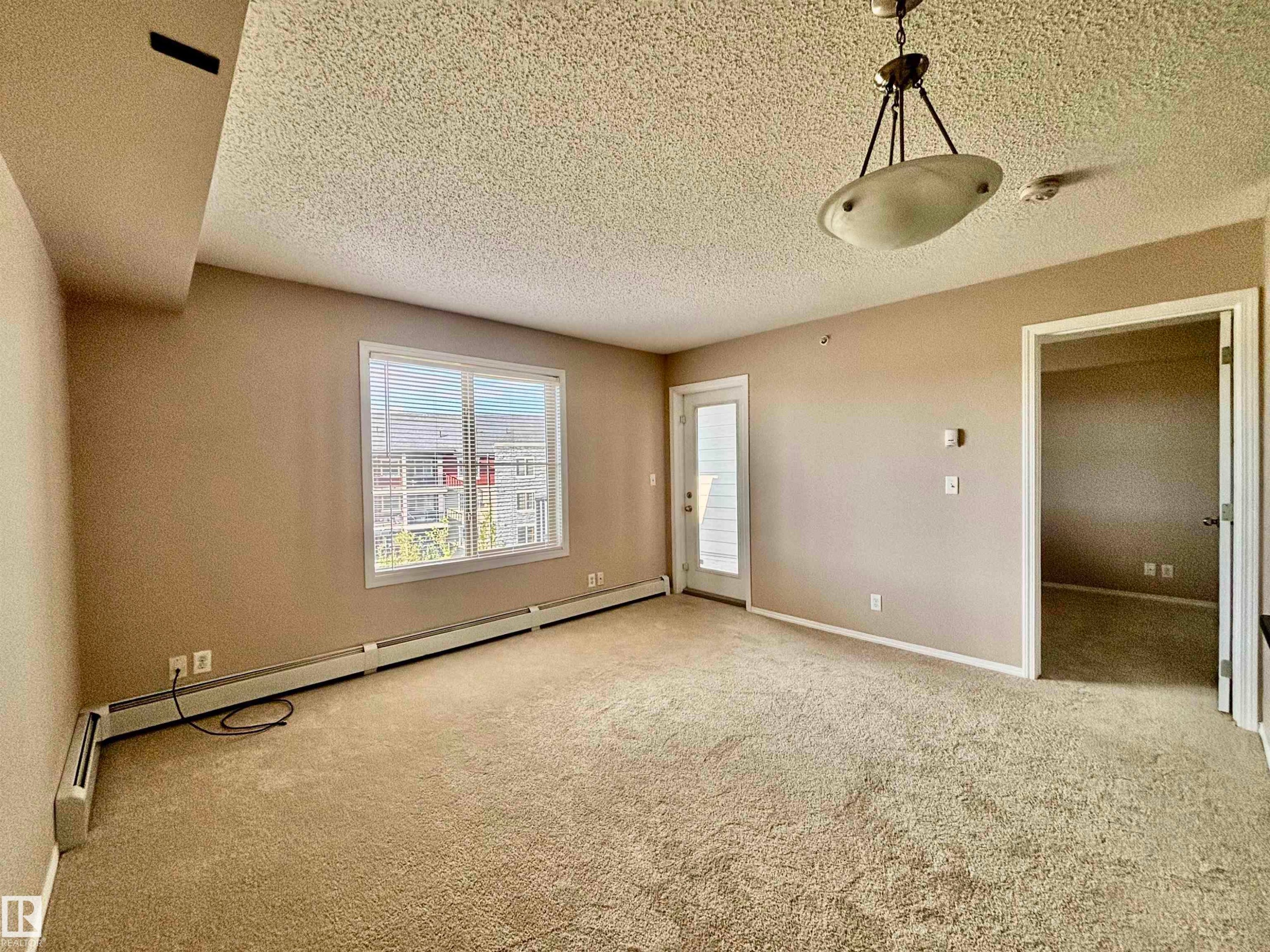 Open-concept floor plan - #409 12035 22 Av Sw, Edmonton, AB - Indoor Photo Showing Other Room