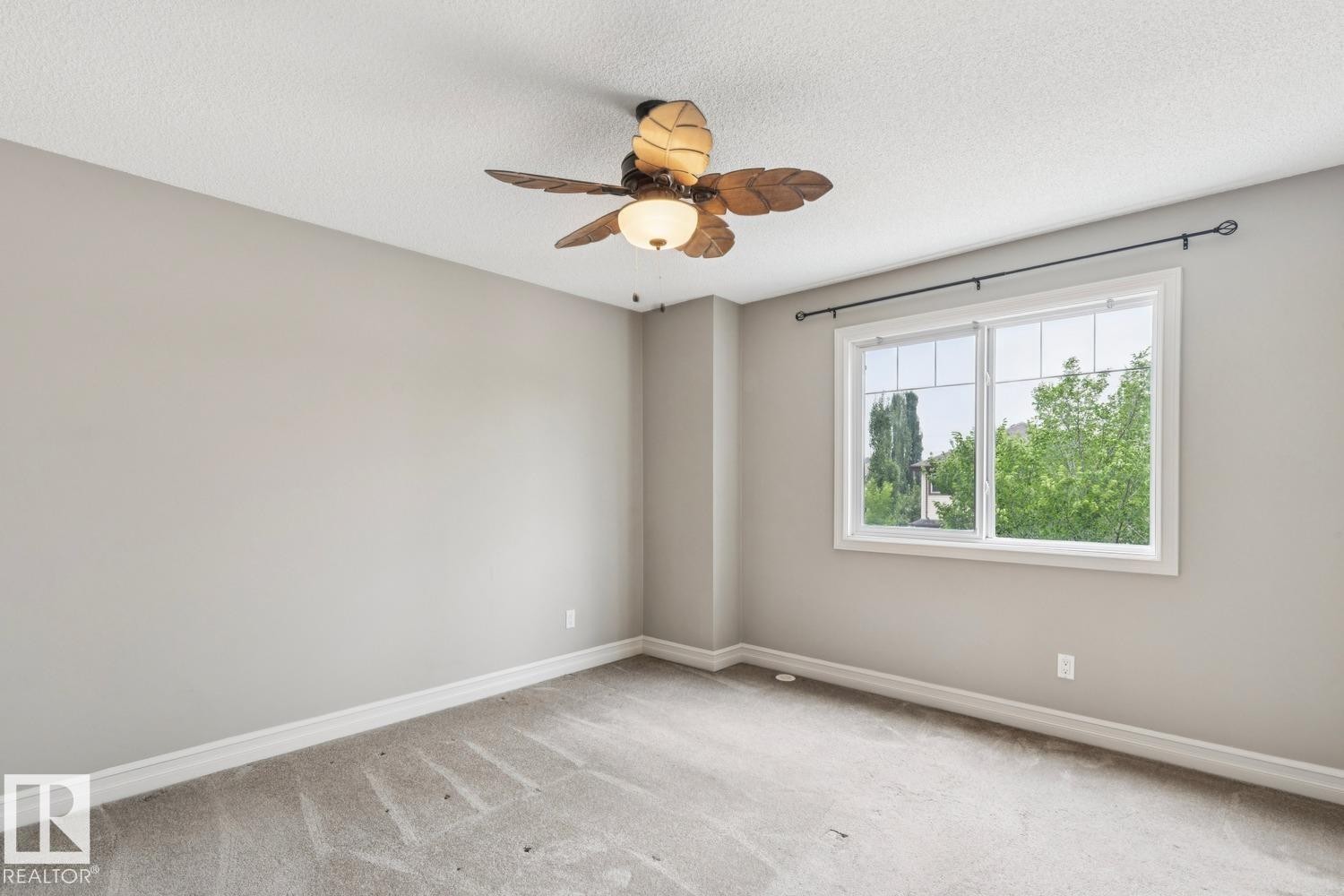 Neutral wall tones, textured ceiling, and carpeted flooring - 5409 3 Avenue Sw, Edmonton, AB - Indoor Photo Showing Other Room