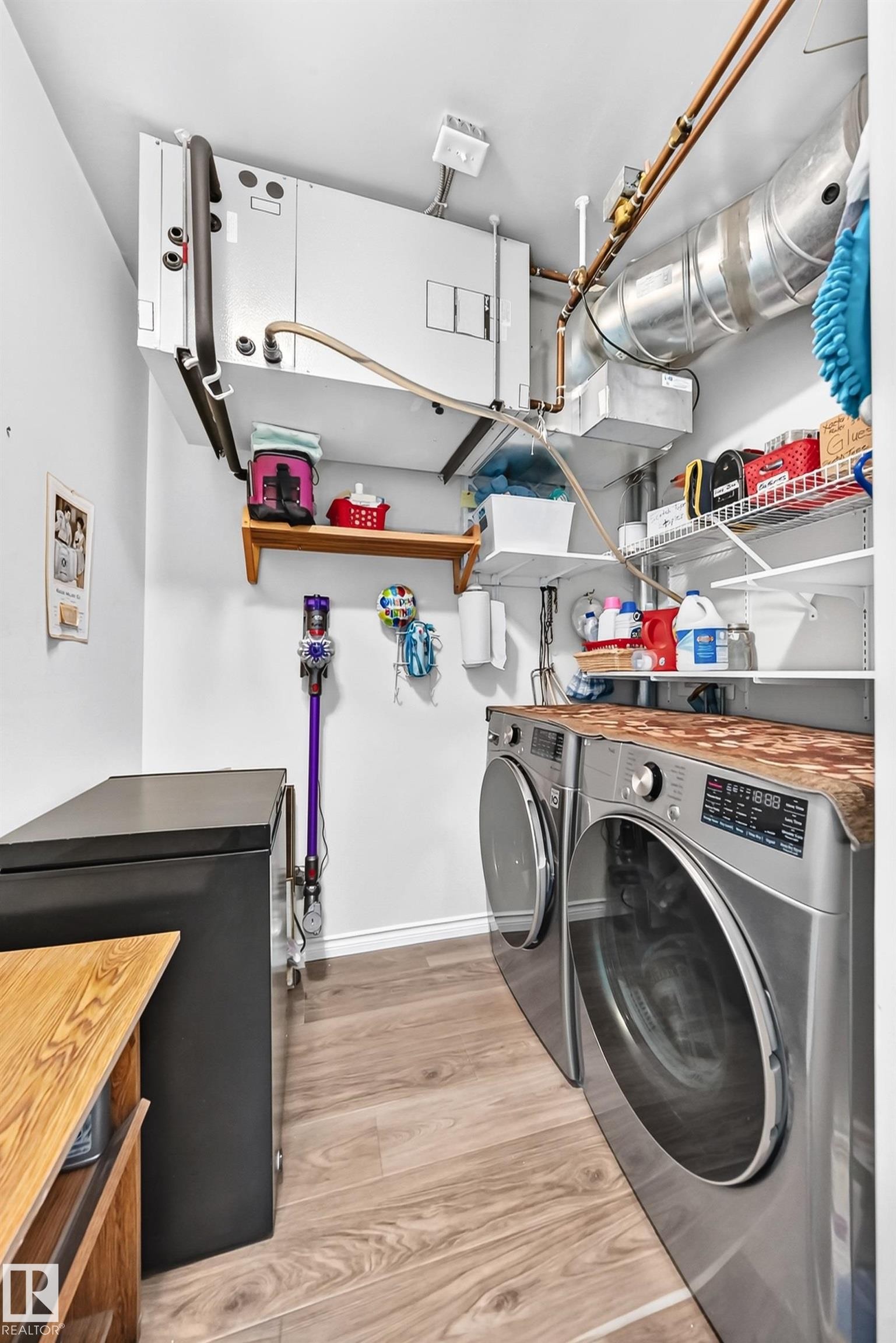 #209 102 Bridgeport Cx, Leduc, AB - Indoor Photo Showing Laundry Room