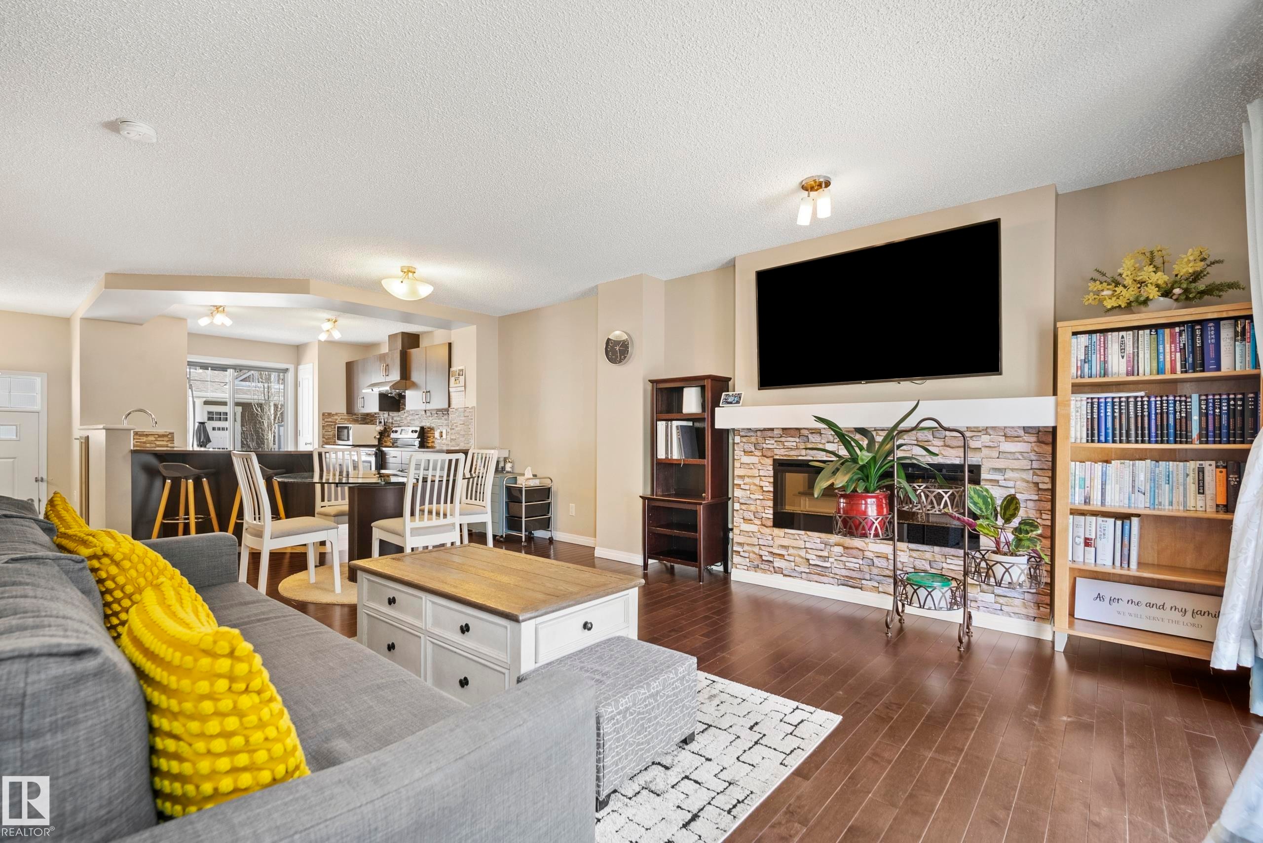 #81 4050 Savaryn Dr Sw, Edmonton, AB - Indoor Photo Showing Living Room With Fireplace