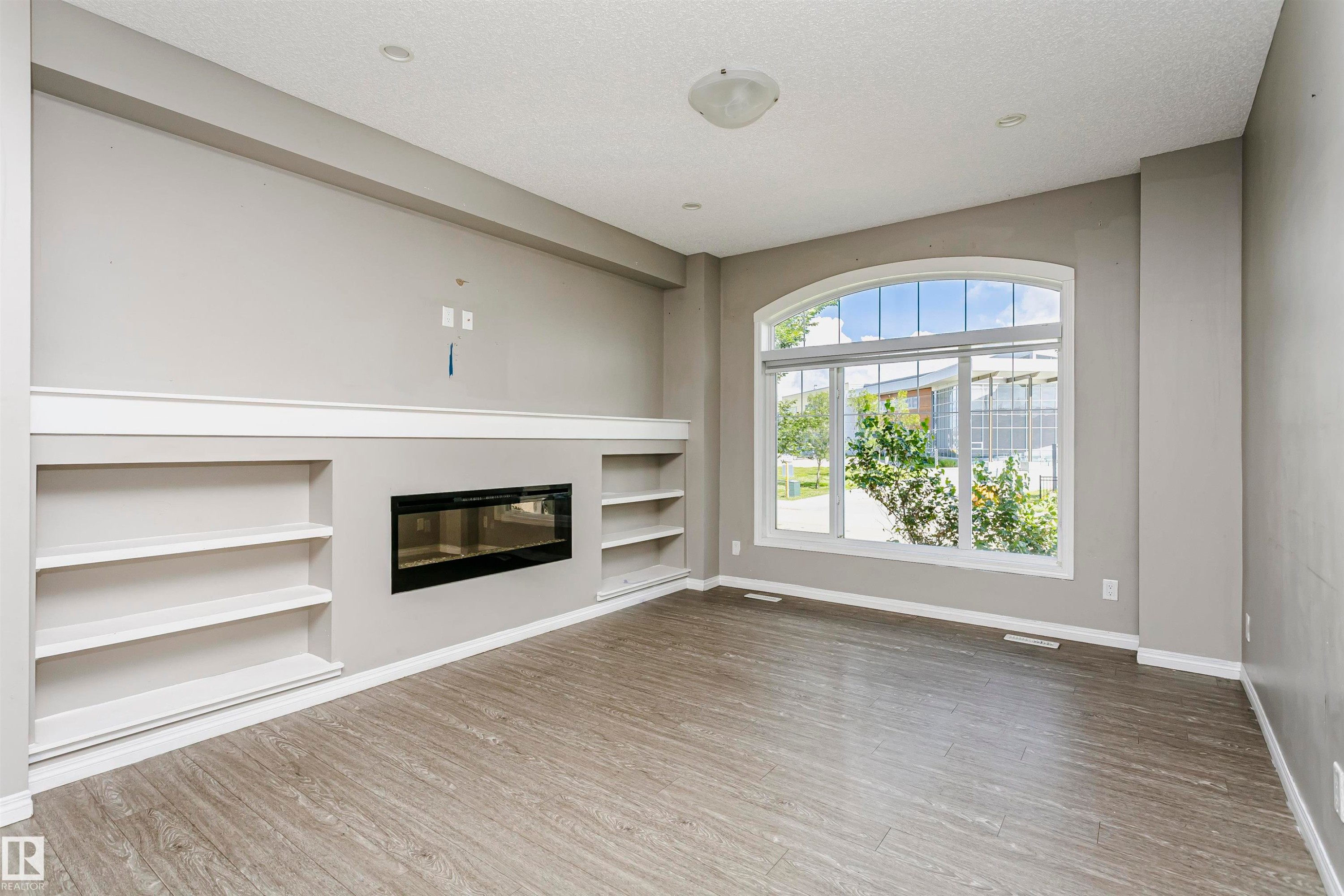 8103 Chappelle Way Sw, Edmonton, AB - Indoor Photo Showing Other Room With Fireplace
