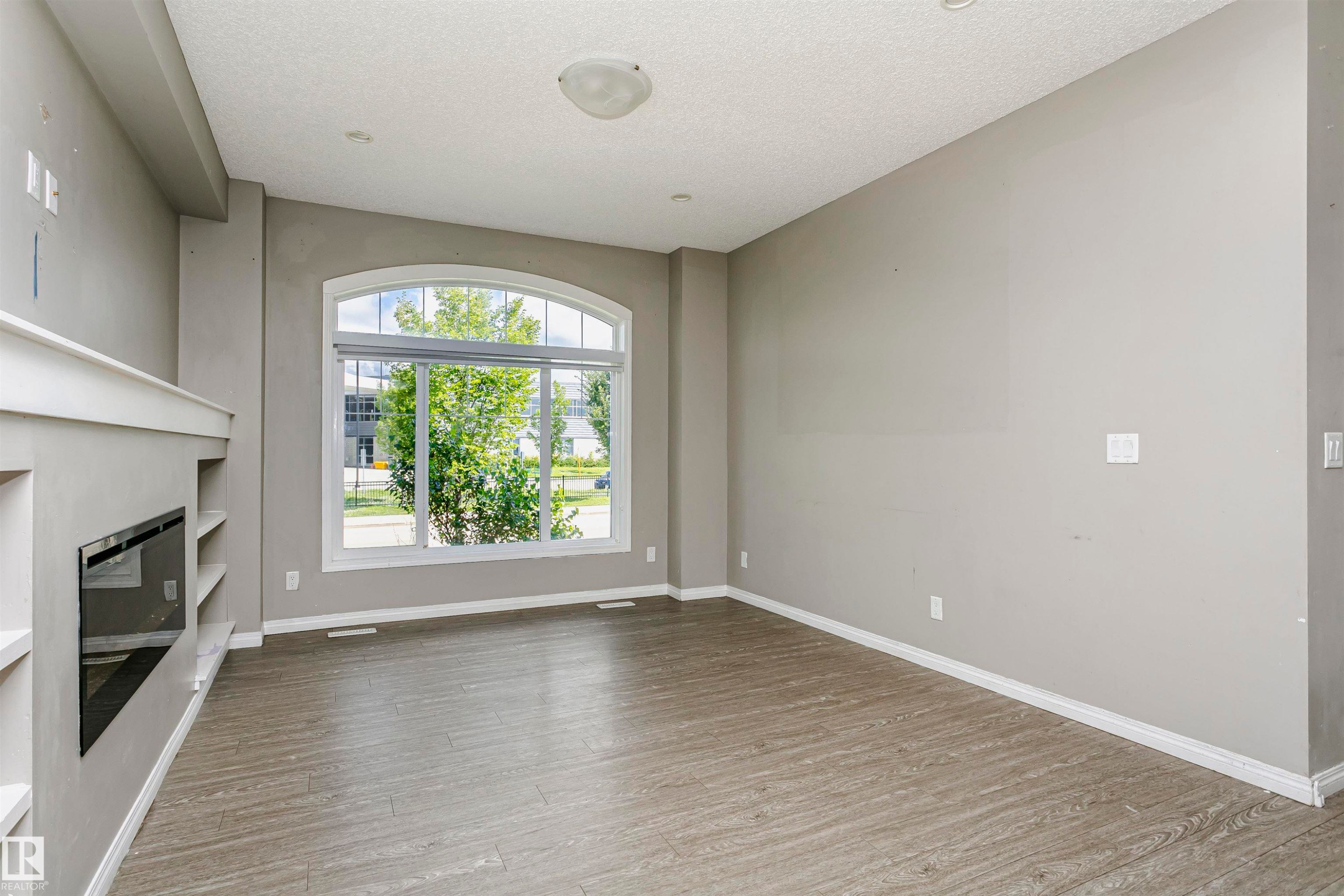 8103 Chappelle Way Sw, Edmonton, AB - Indoor Photo Showing Other Room With Fireplace