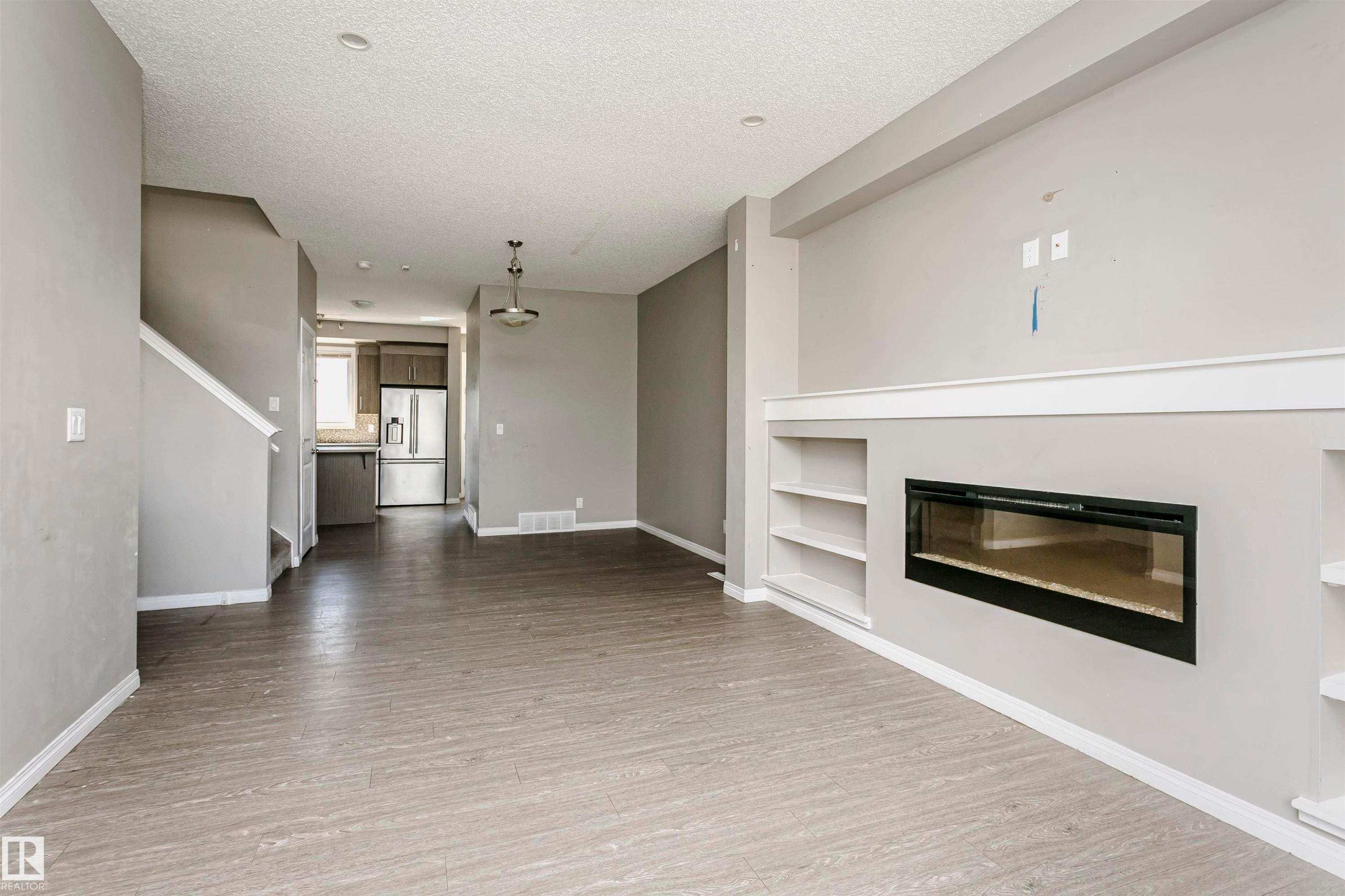 8103 Chappelle Way Sw, Edmonton, AB - Indoor Photo Showing Living Room With Fireplace
