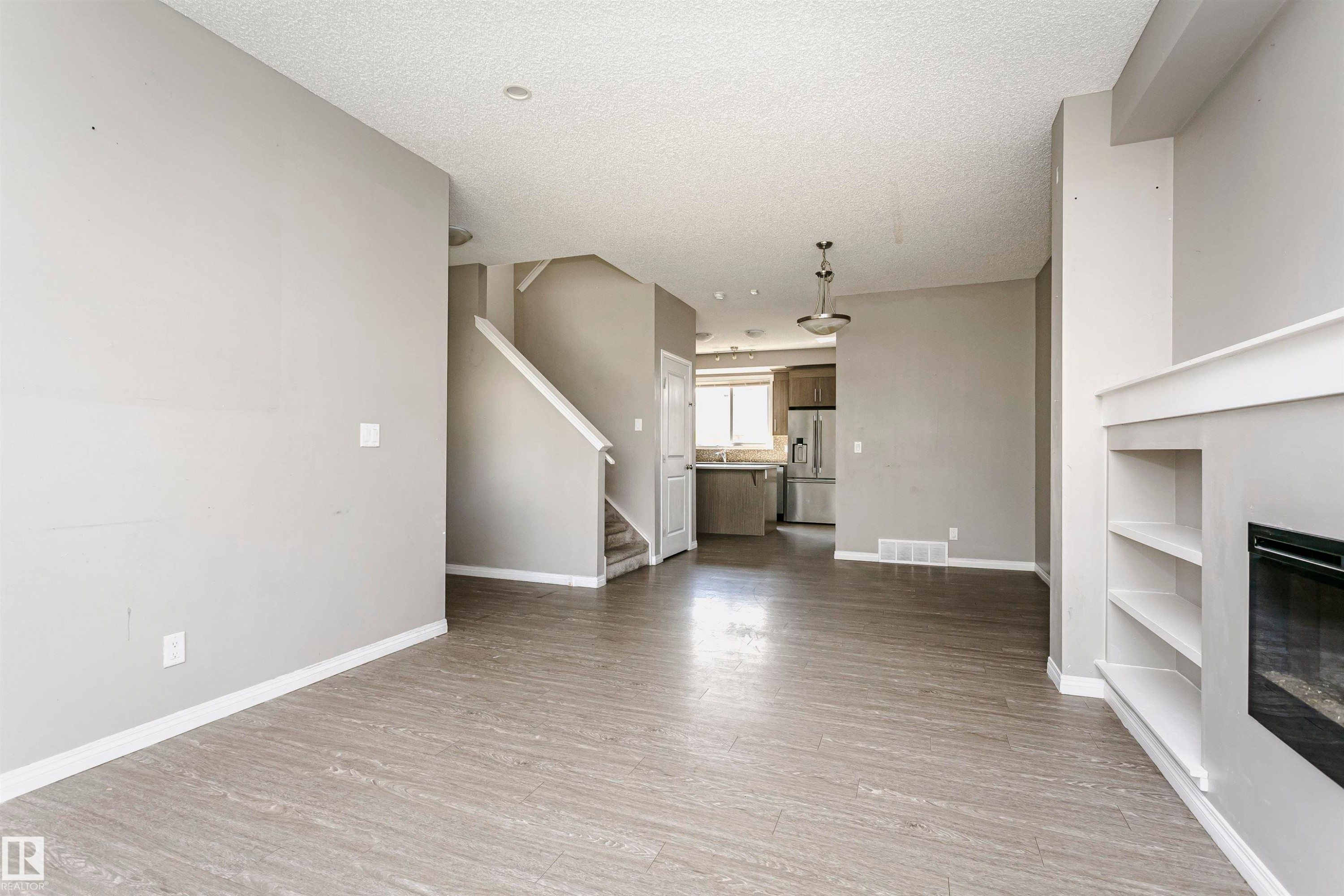 8103 Chappelle Way Sw, Edmonton, AB - Indoor Photo Showing Other Room With Fireplace