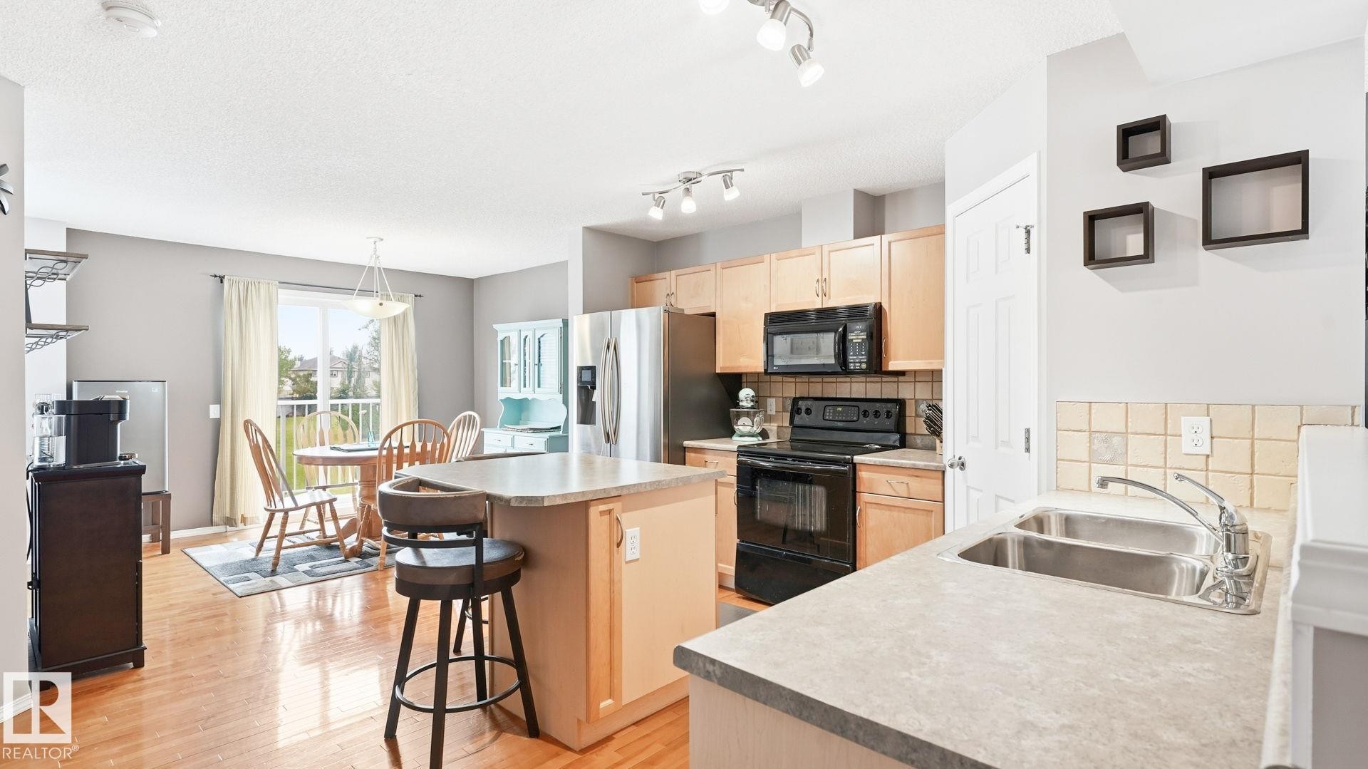 #58 8304 11 Av Sw, Edmonton, AB - Indoor Photo Showing Kitchen With Double Sink
