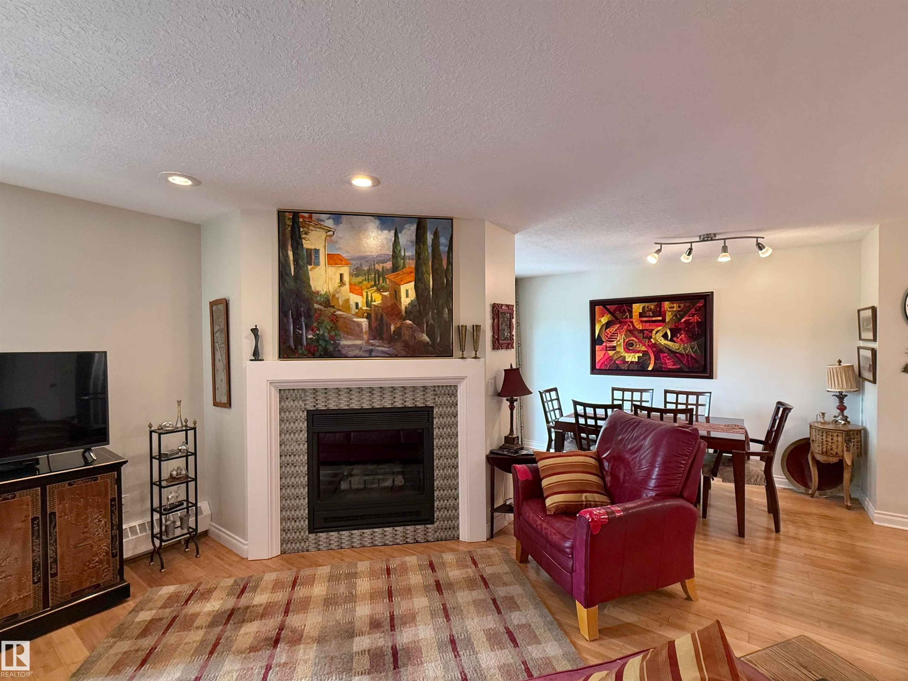 #403 3 Perron St, St. Albert, AB - Indoor Photo Showing Living Room With Fireplace