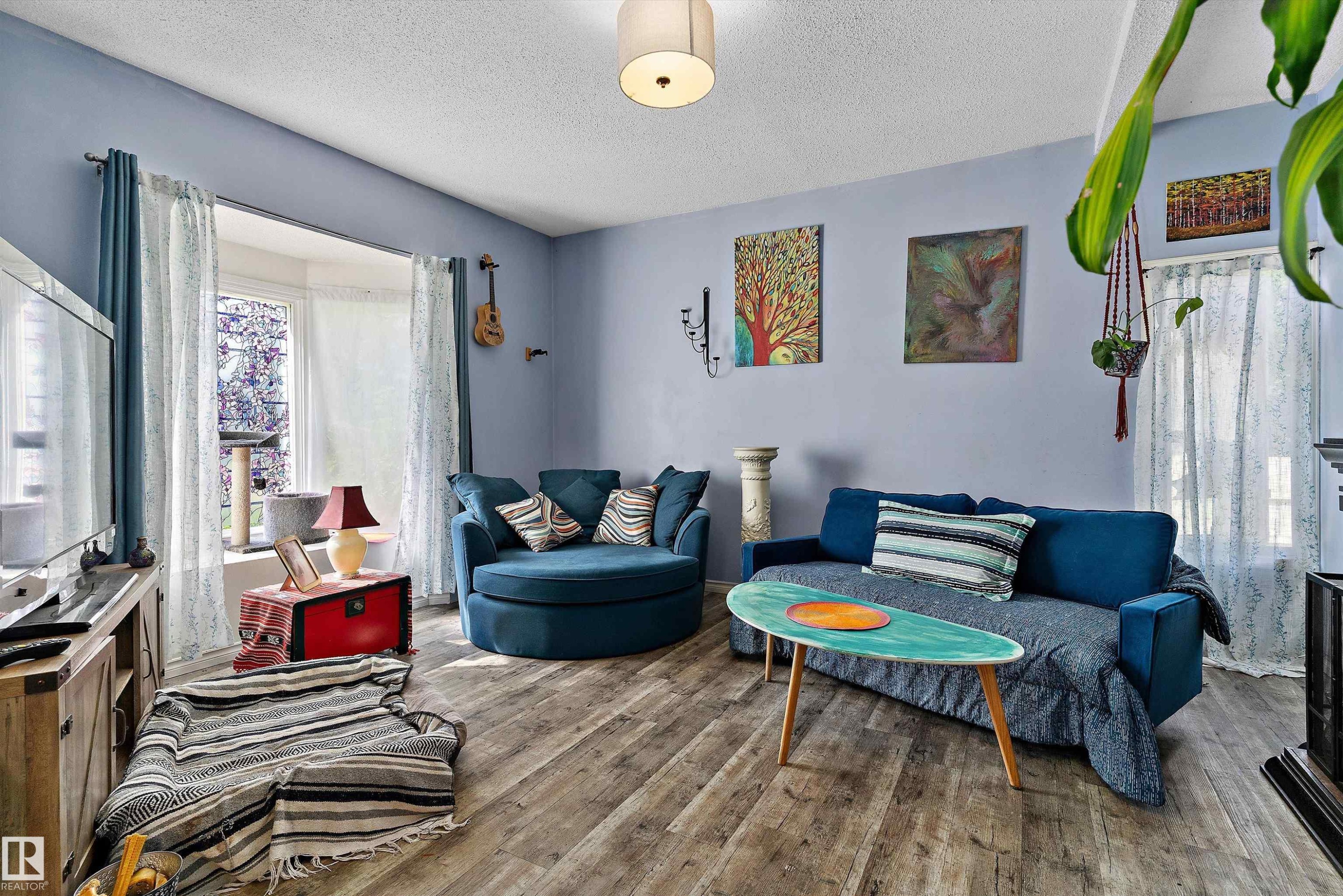 Wood-finish flooring throughout - 5404 45 Avenue, Wetaskiwin, AB - Indoor Photo Showing Living Room