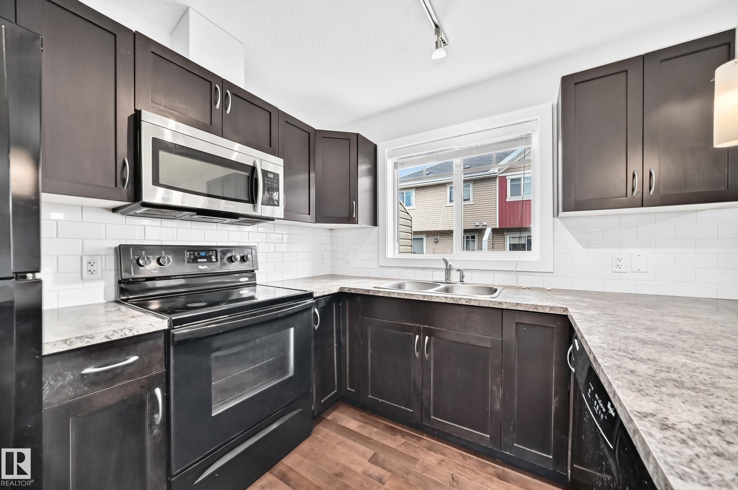 #73 9535 217 St Nw, Edmonton, AB - Indoor Photo Showing Kitchen With Double Sink