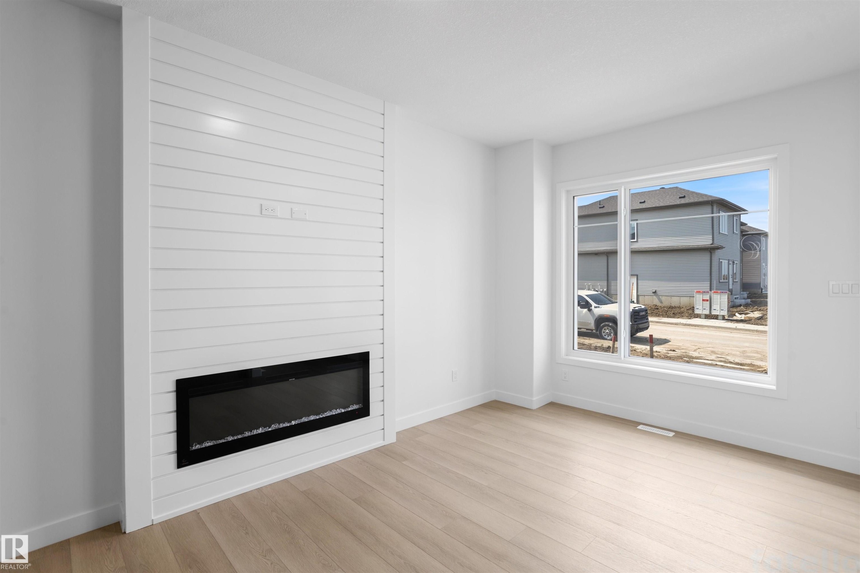 1563 211 Street Nw, Edmonton, AB - Indoor Photo Showing Living Room With Fireplace