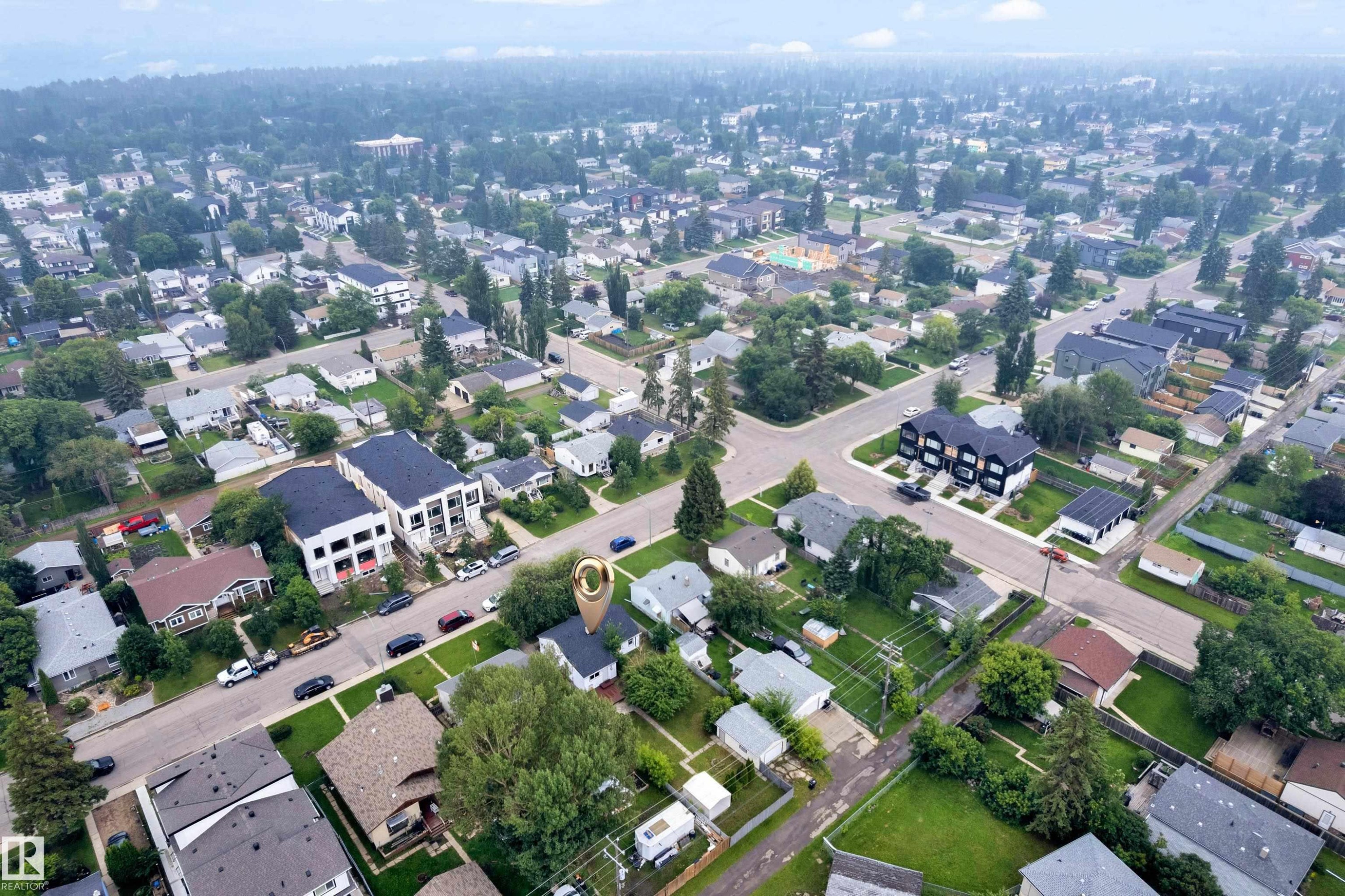Aerial perspective showcasing a residential area with varied housing structures and mature landscaping - 9416 153 Street Nw, Edmonton, AB - With View