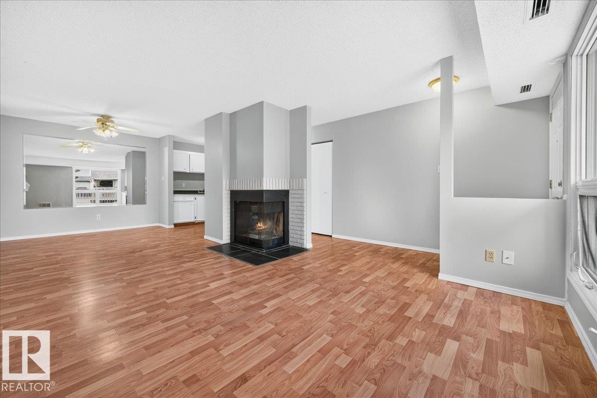 #35 2115 118 St Nw, Edmonton, AB - Indoor Photo Showing Living Room With Fireplace