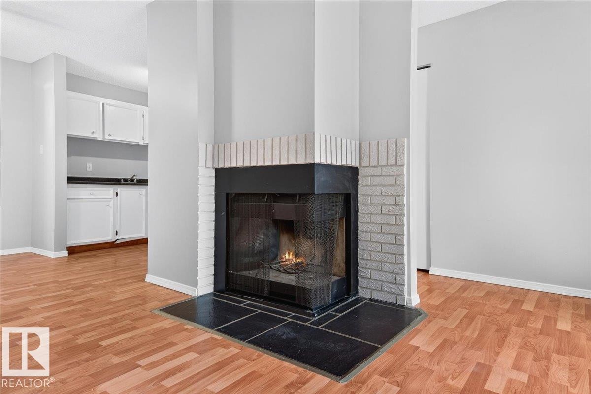 #35 2115 118 St Nw, Edmonton, AB - Indoor Photo Showing Living Room With Fireplace